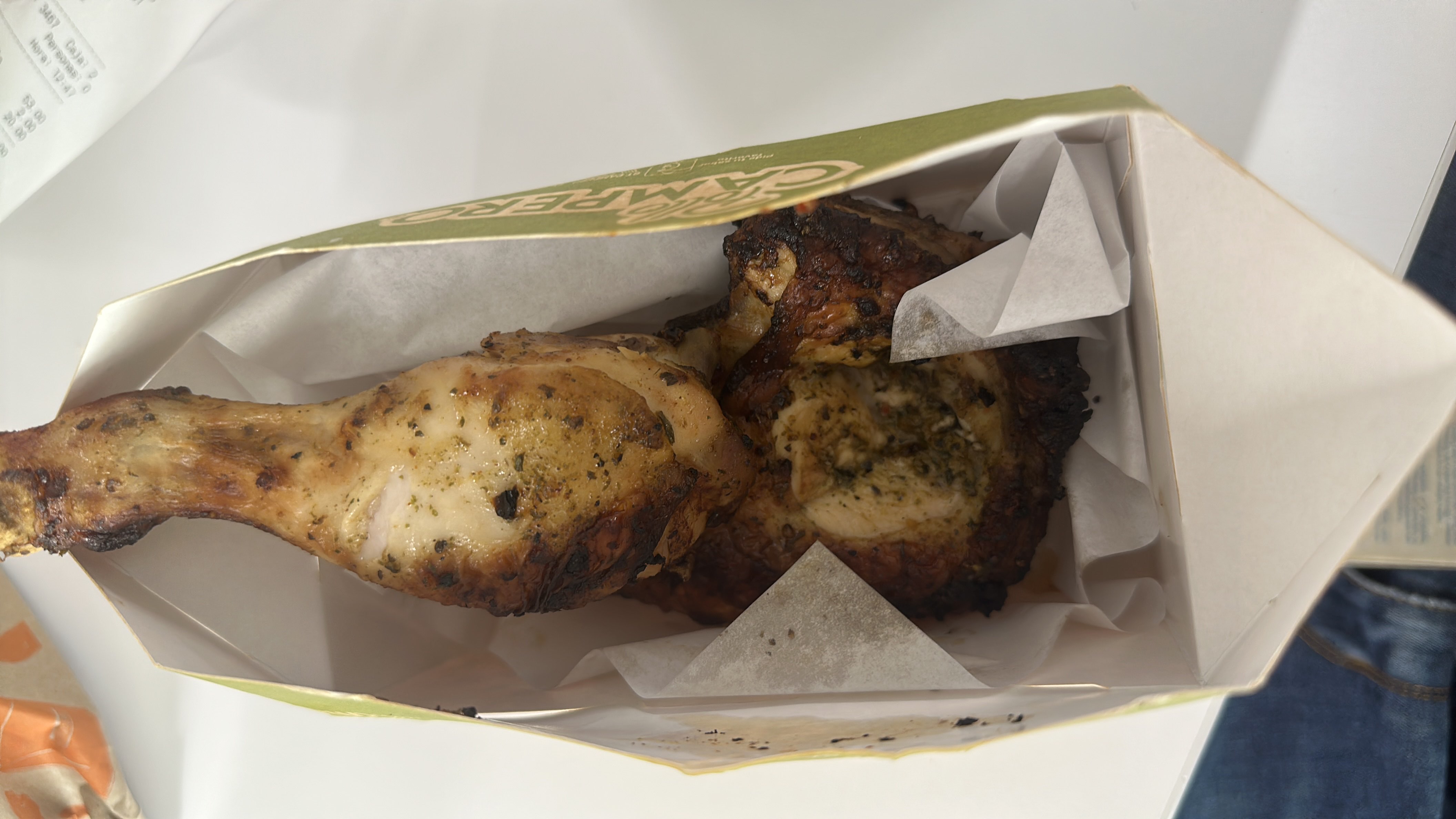 A serving of grilled chicken, seasoned with herbs and spices, providing a high-protein, low-carb meal option.