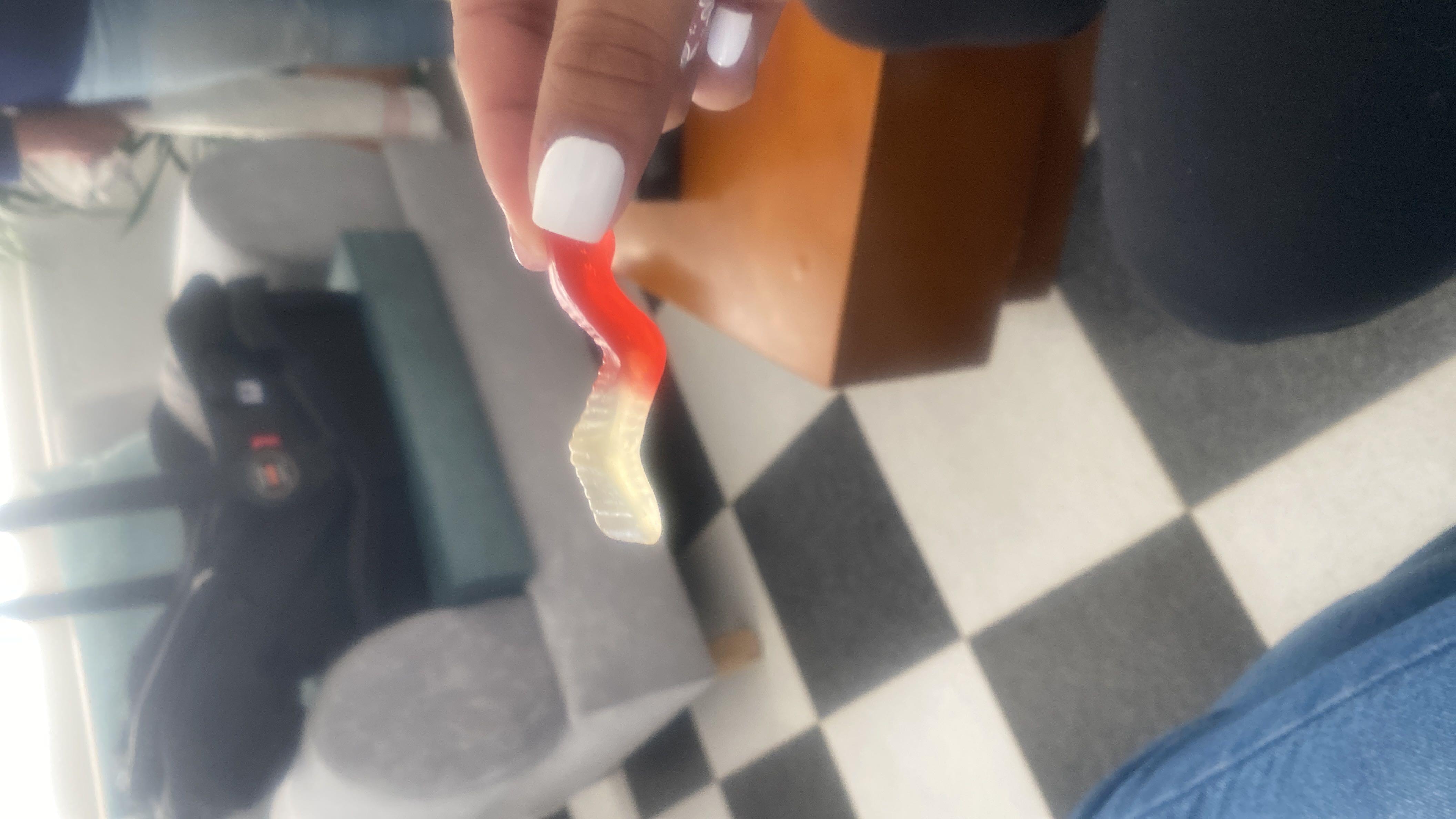 A gummy candy, likely high in sugar and low in nutritional value.