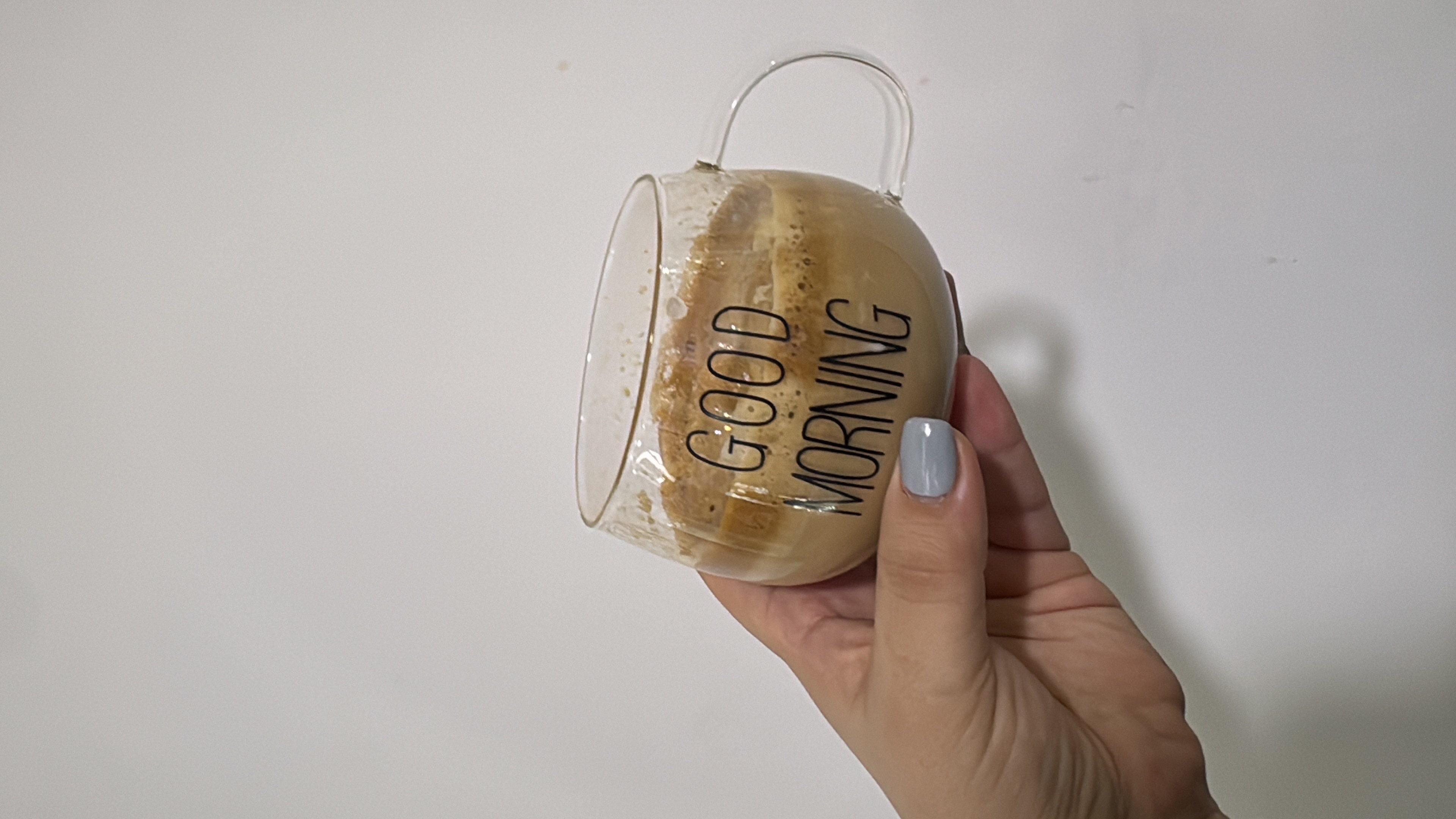 A cup of coffee with milk and sugar, providing a moderate calorie count and a balanced nutritional profile.