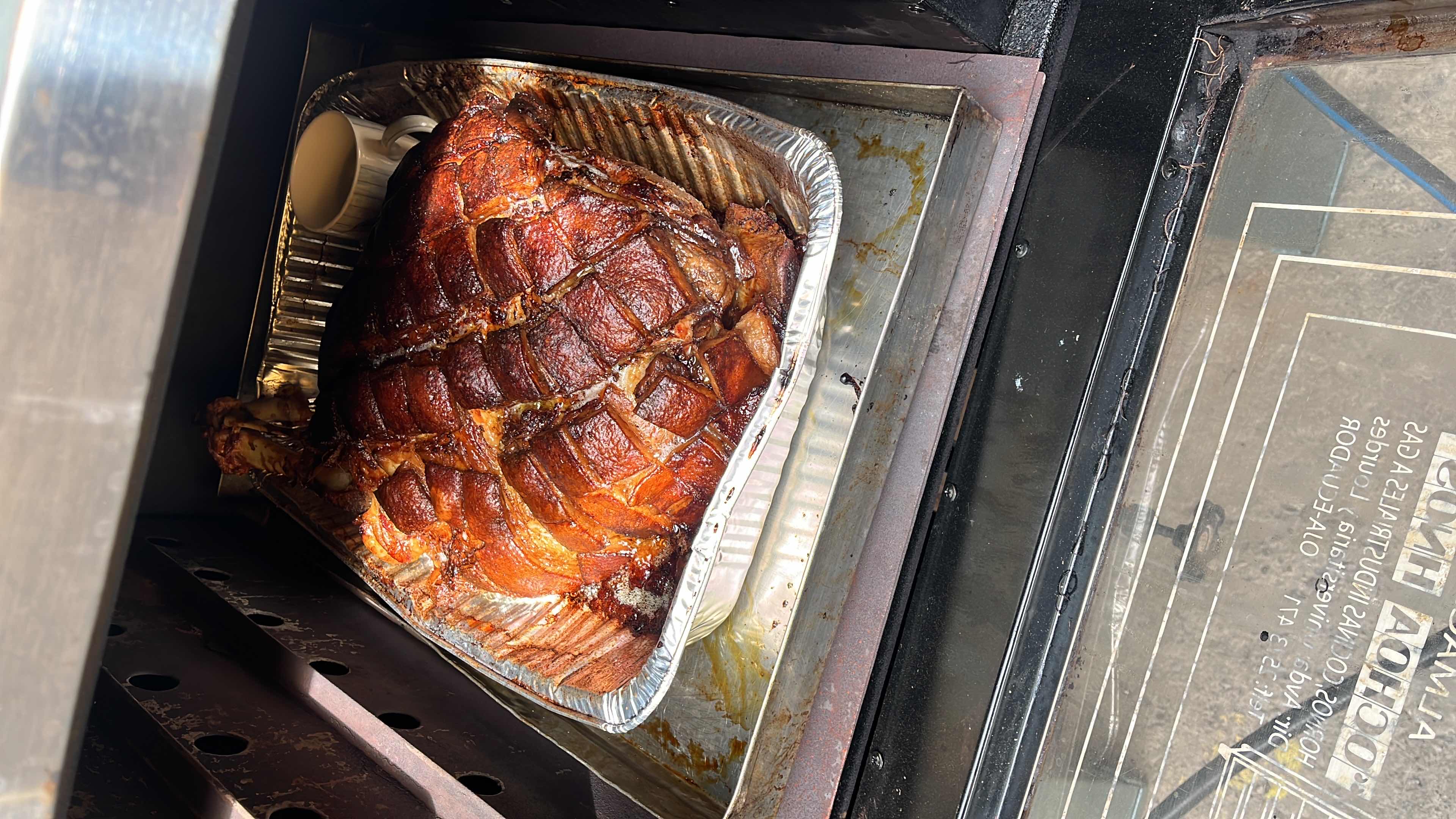 A roasted pork dish with a caramelized glaze, cooked in an oven.