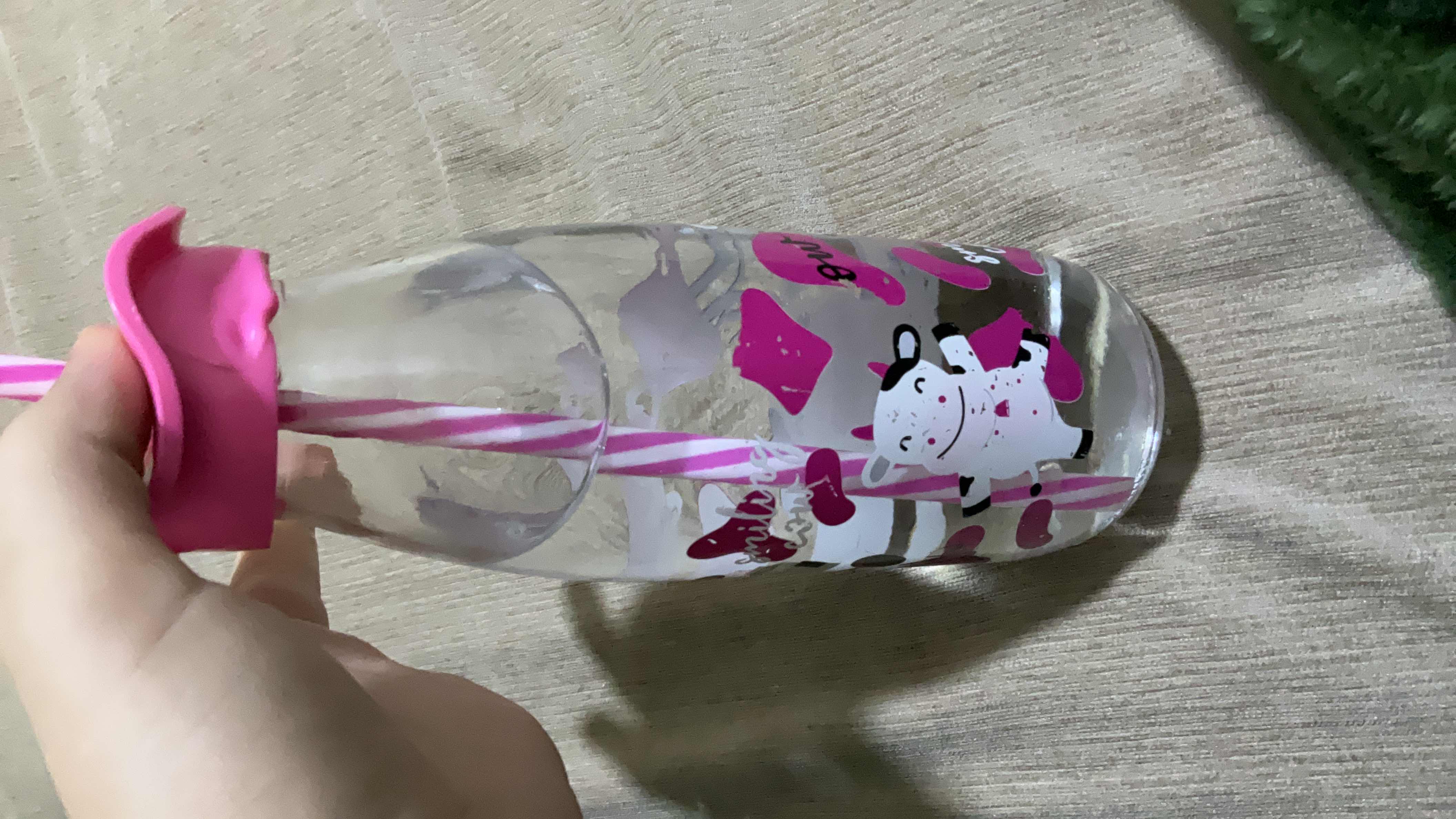 The image shows a bottle of water, which is calorie-free and contains no macronutrients.