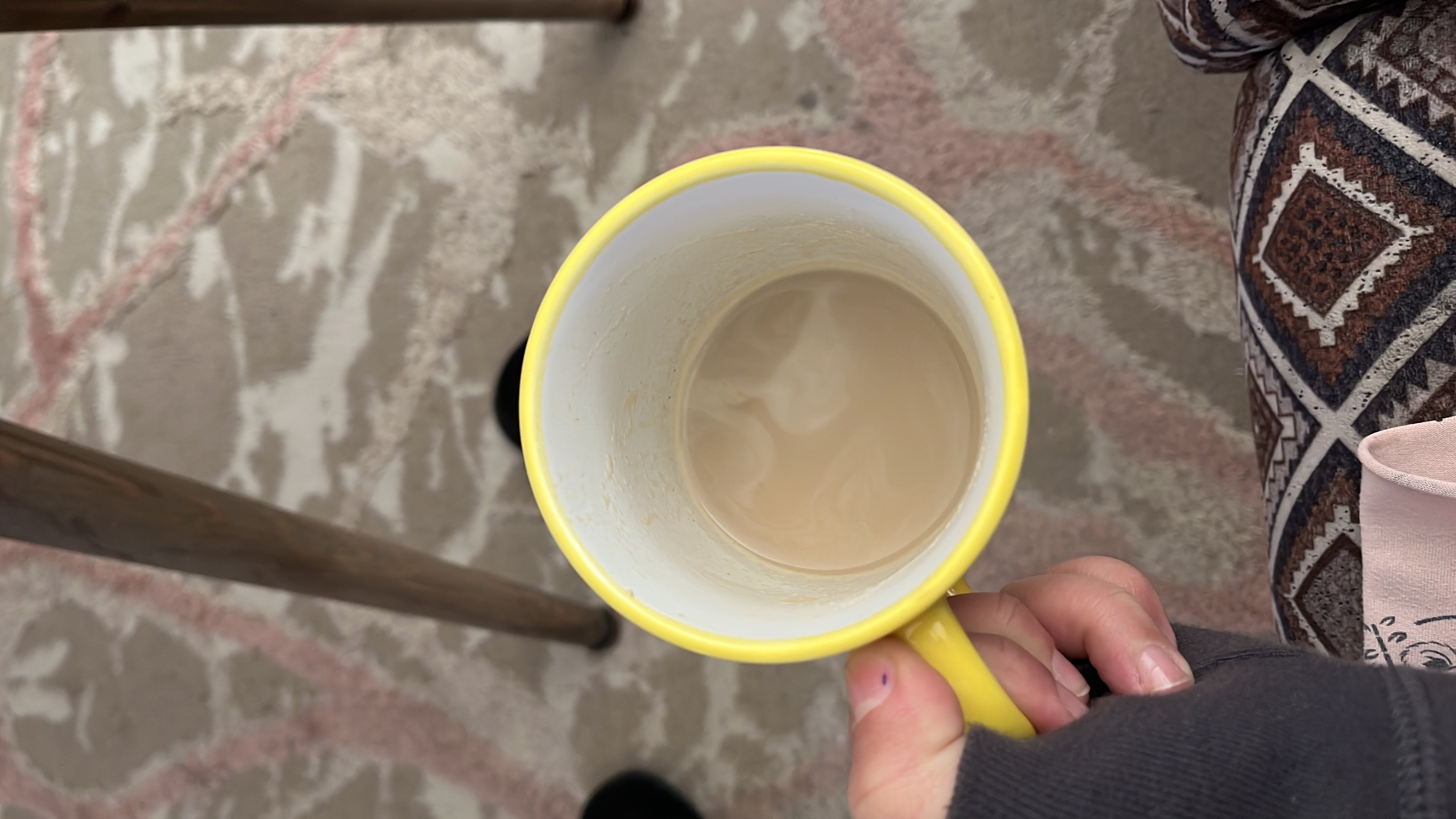A cup of coffee with milk, providing a moderate amount of calories and nutrients.