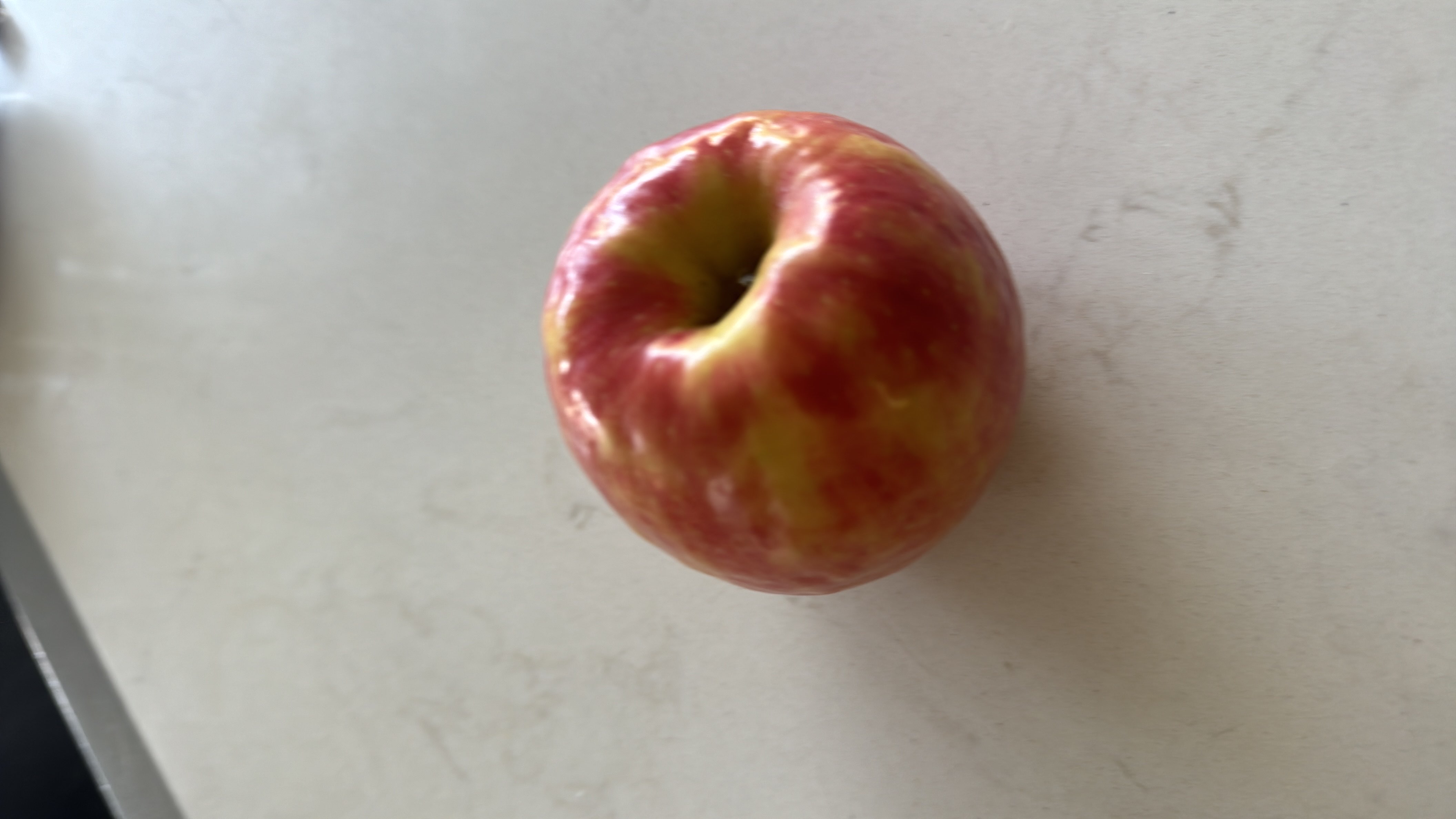 The image shows an apple, a nutritious fruit that is low in calories and fats, high in carbohydrates, and provides dietary fiber.