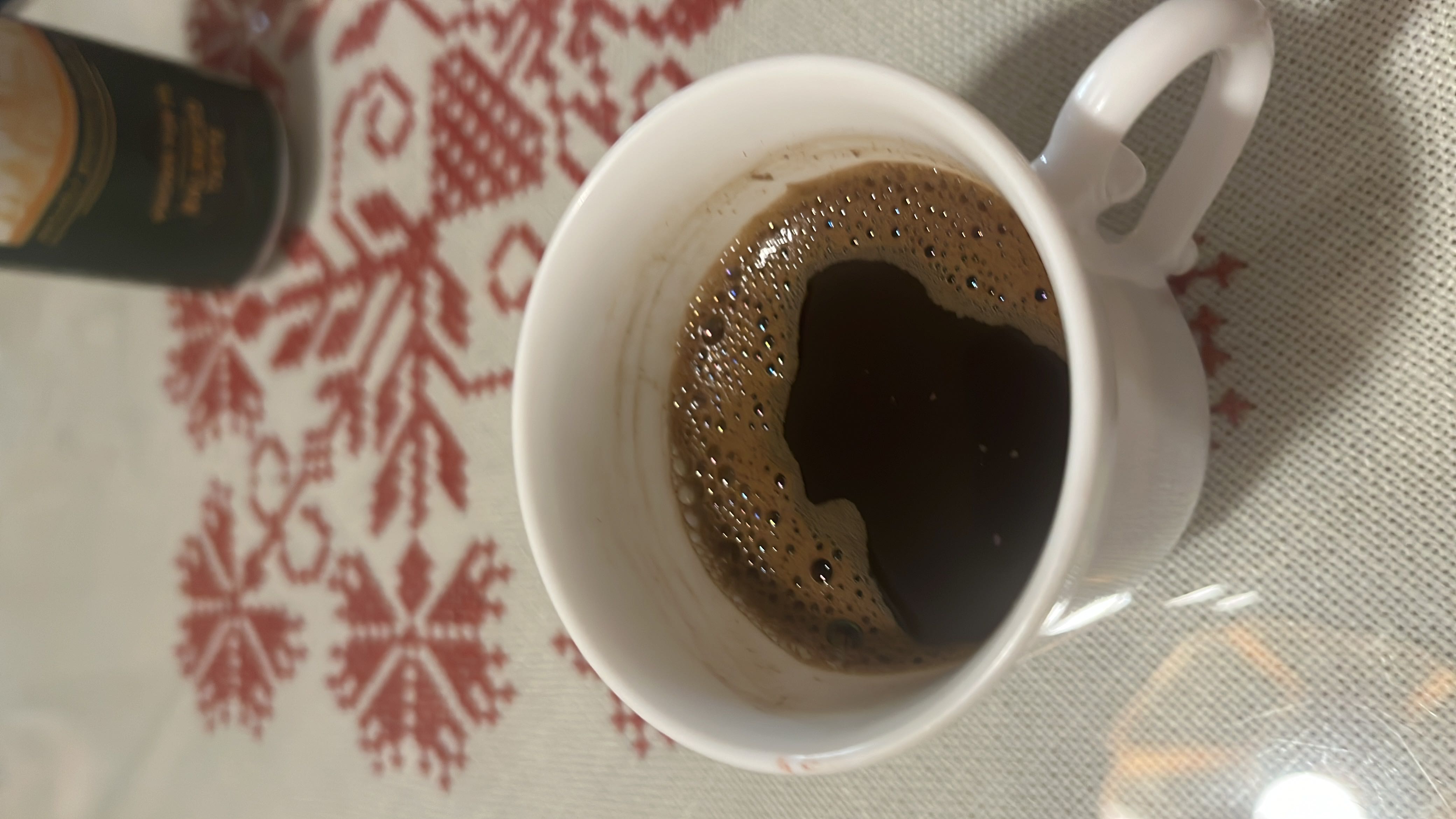 A cup of black coffee, low in calories and free of fats, carbs, and protein.