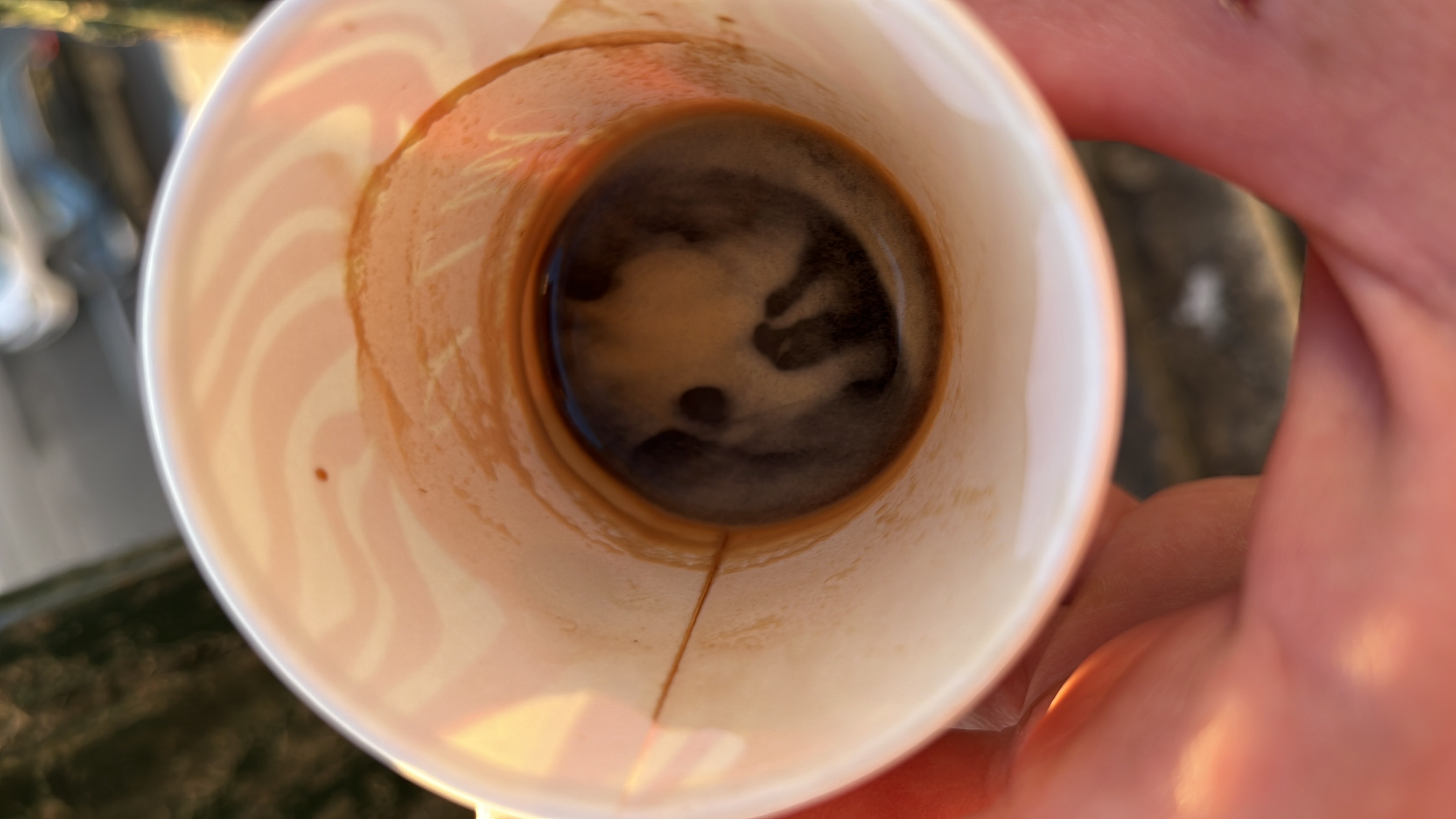 The image shows a small amount of espresso in a cup, which is low in calories and contains minimal nutrients.