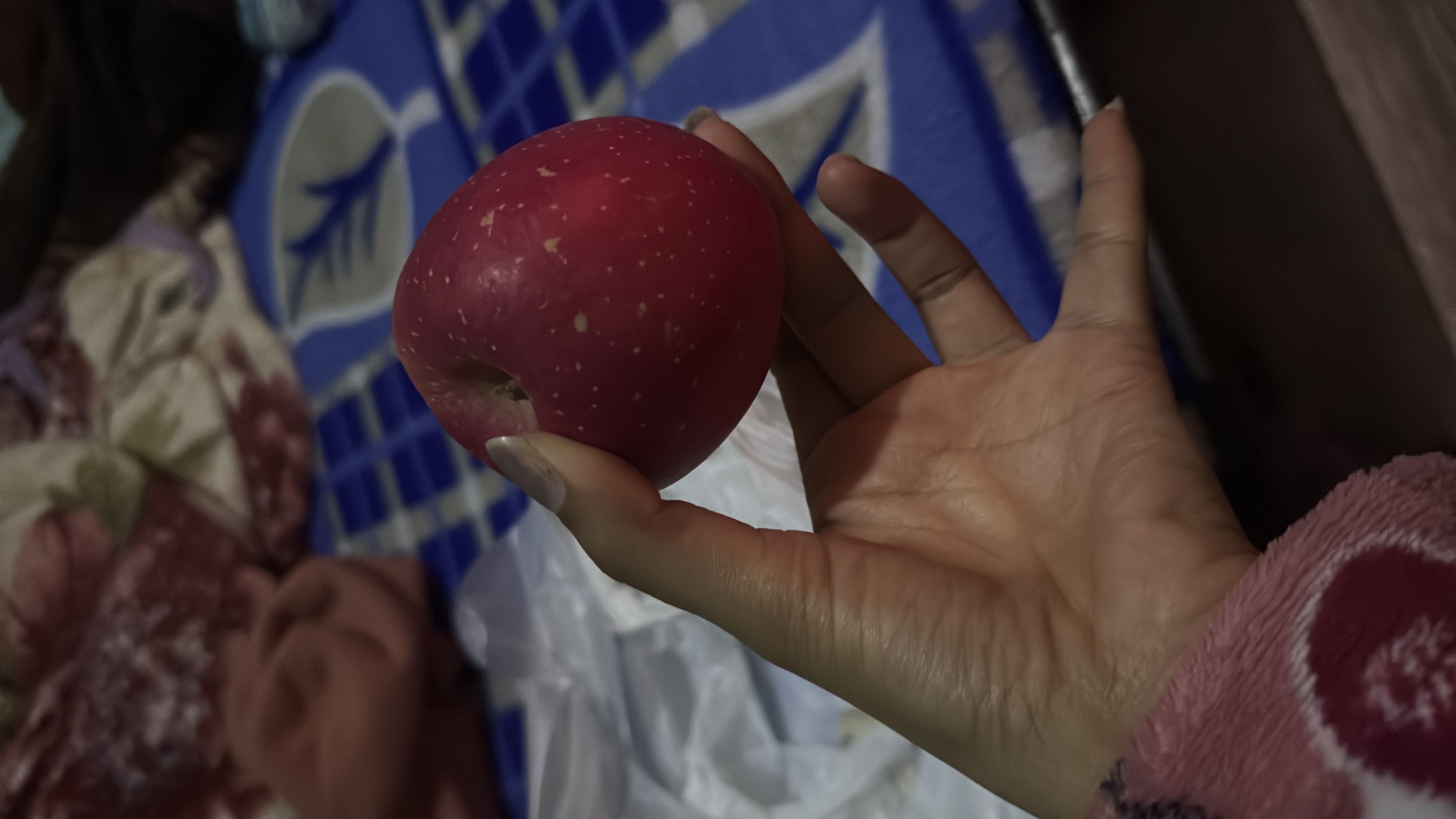 The image shows a red apple, which is a nutritious fruit low in calories and fats, and high in carbohydrates.