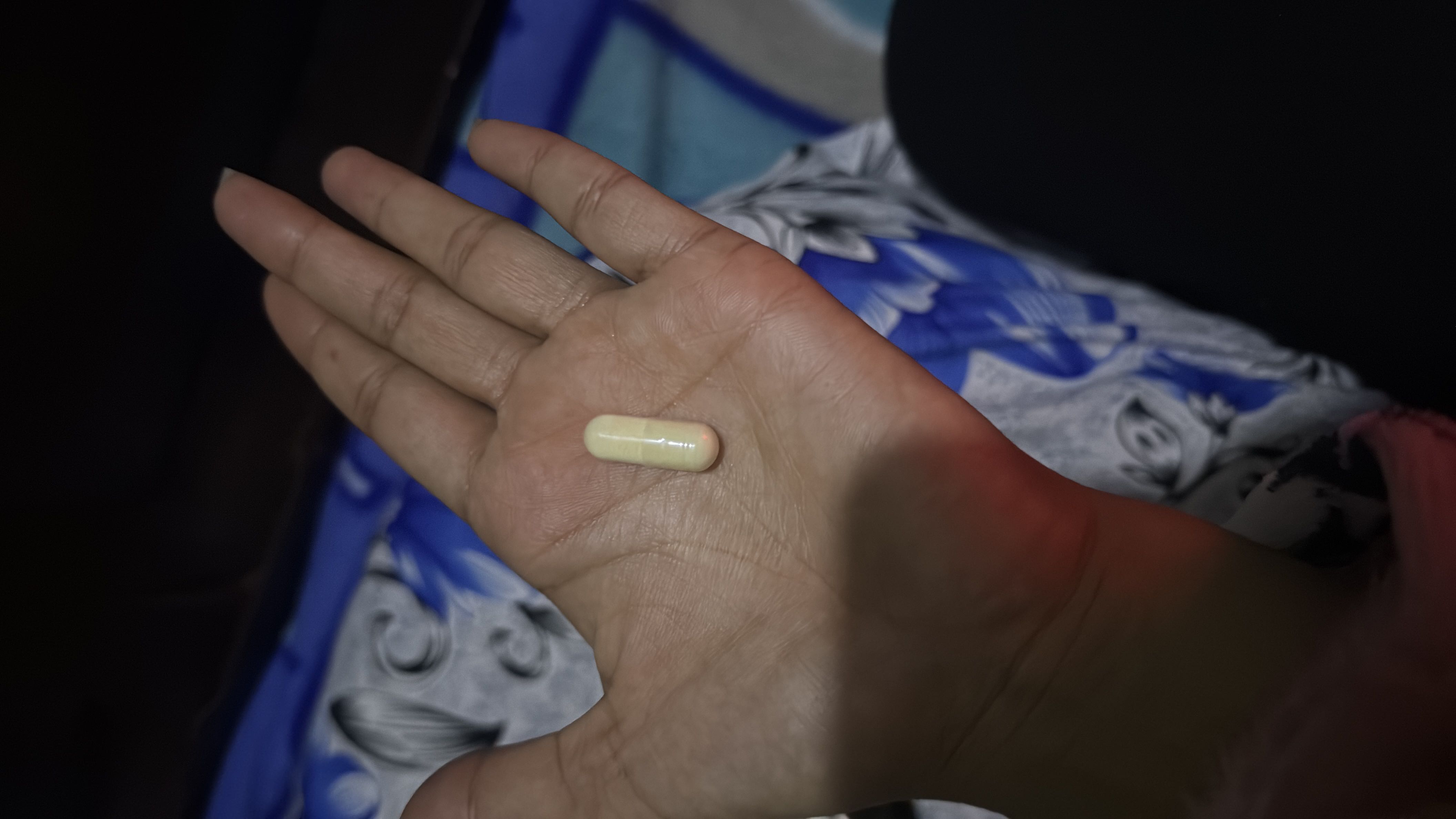The image shows a capsule, which typically contains no significant nutritional value.