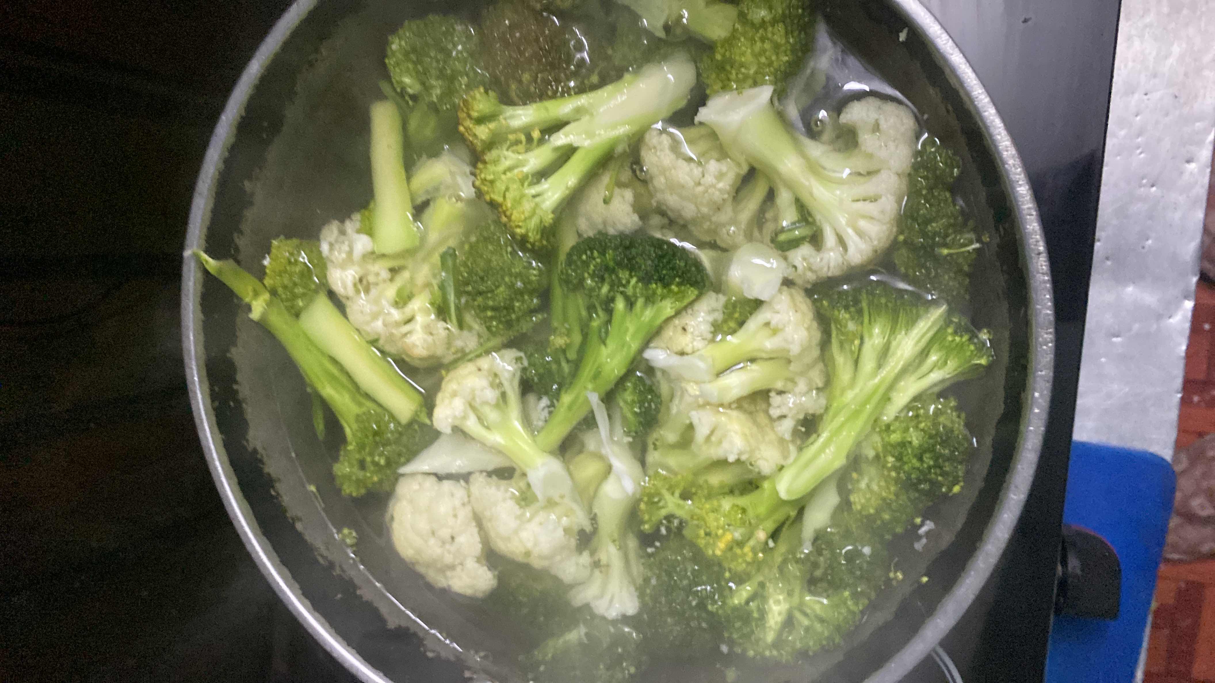 A pot of steamed broccoli and cauliflower, low in calories and rich in nutrients.