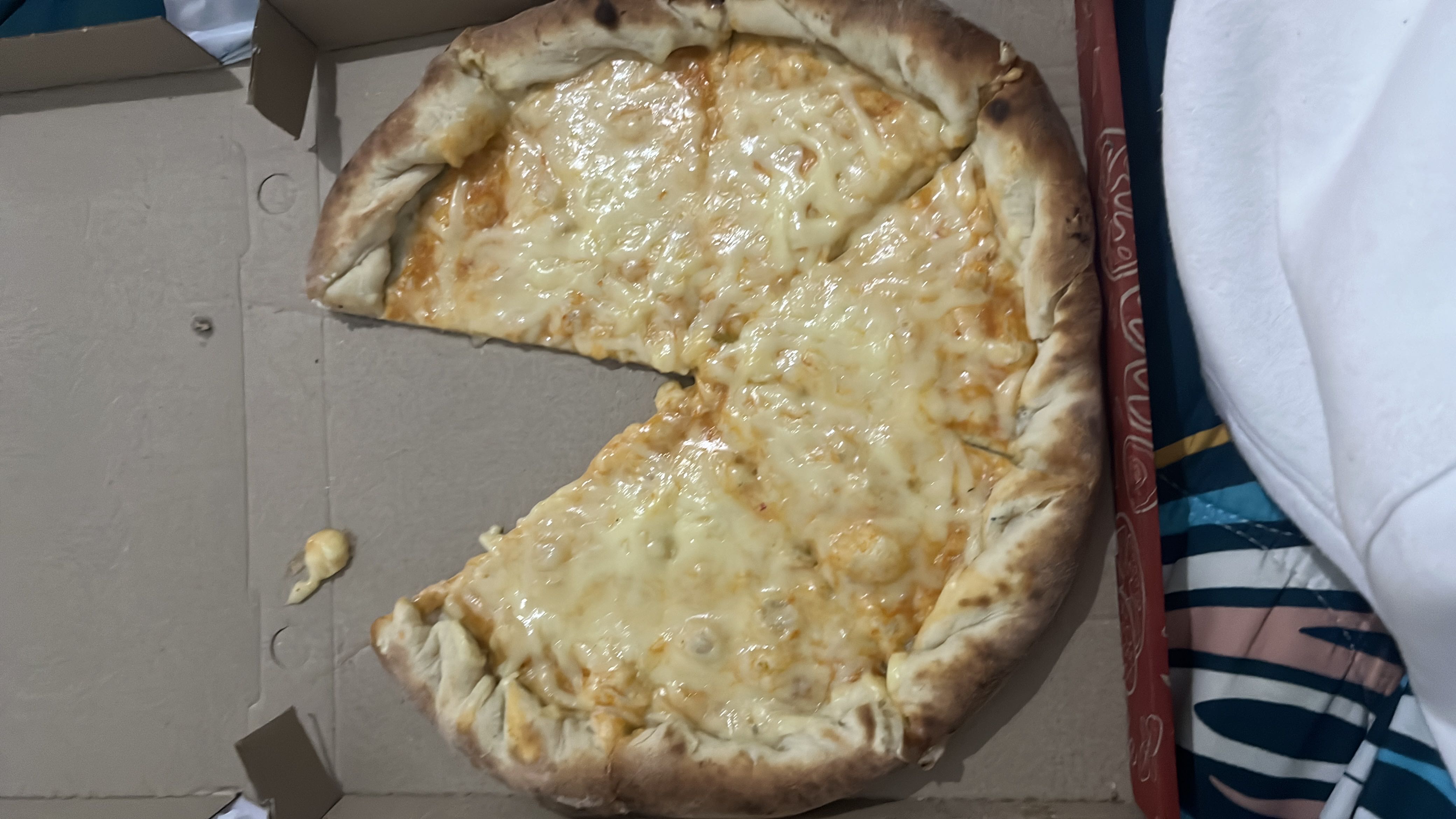 A cheese pizza with a thick crust, featuring melted cheese and tomato sauce.