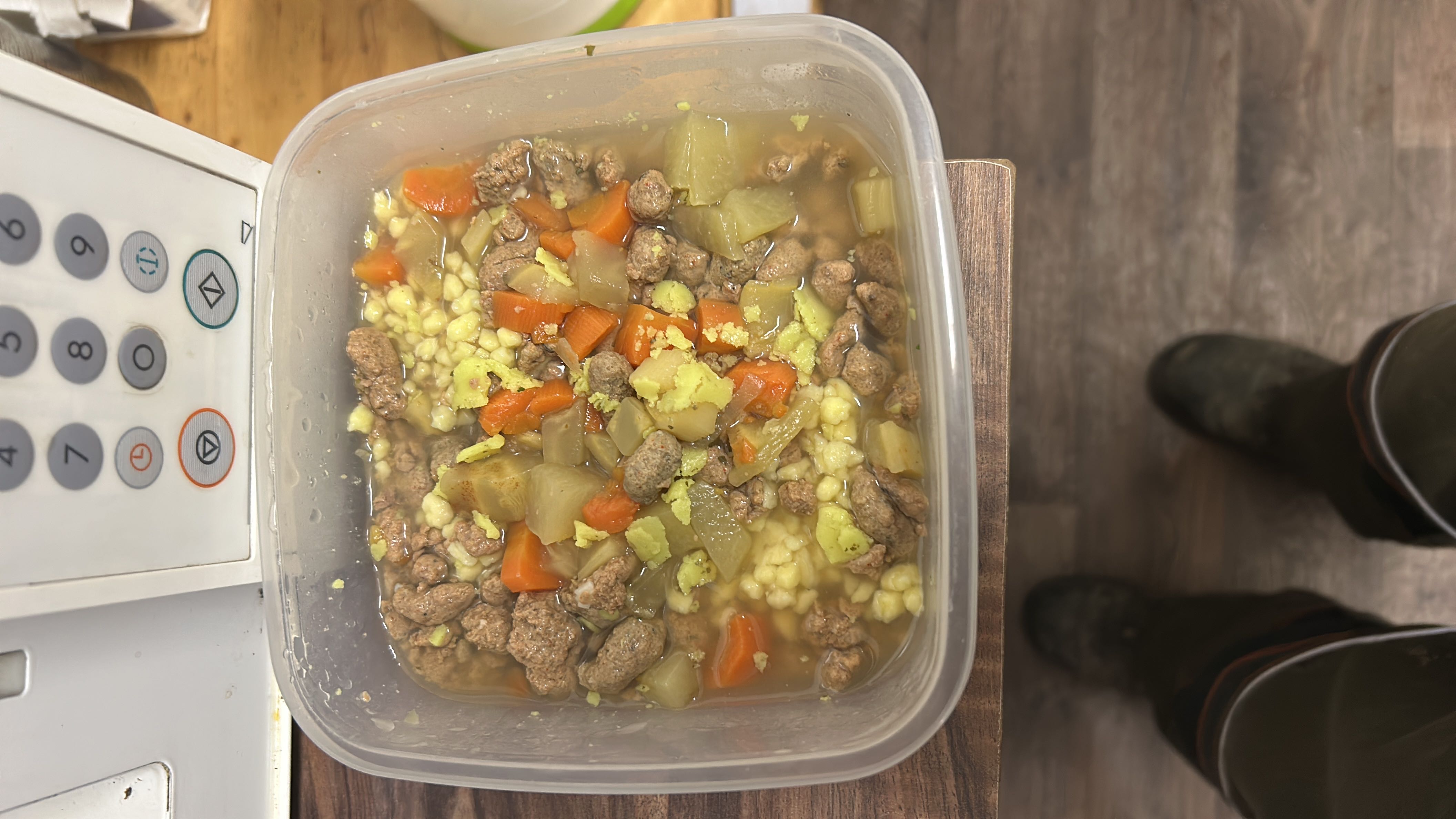 A hearty soup containing beef, carrots, potatoes, and pearl barley, providing a balanced mix of protein, carbs, and fats.