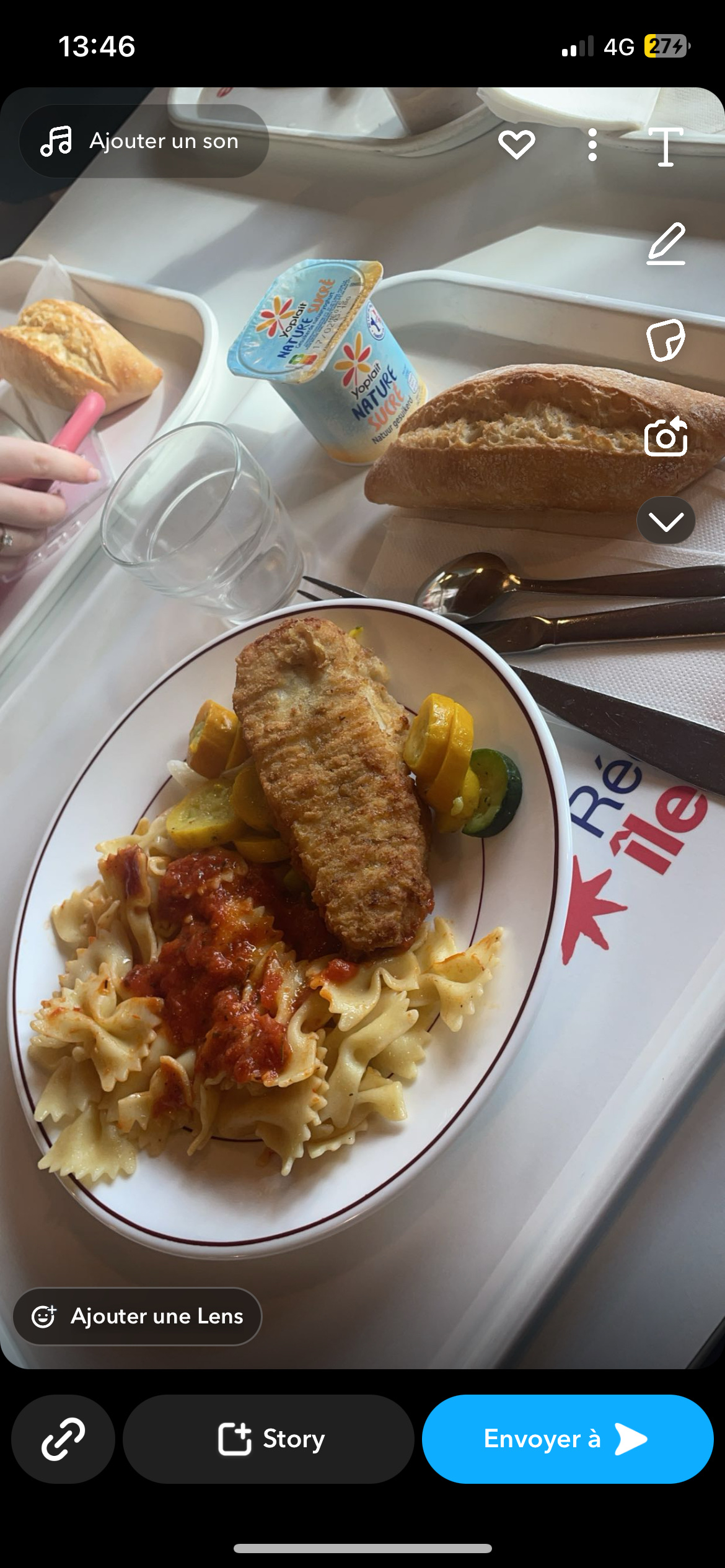 A balanced meal consisting of pasta with tomato sauce, bread, a breaded fish fillet, steamed vegetables, and sweetened natural yogurt.