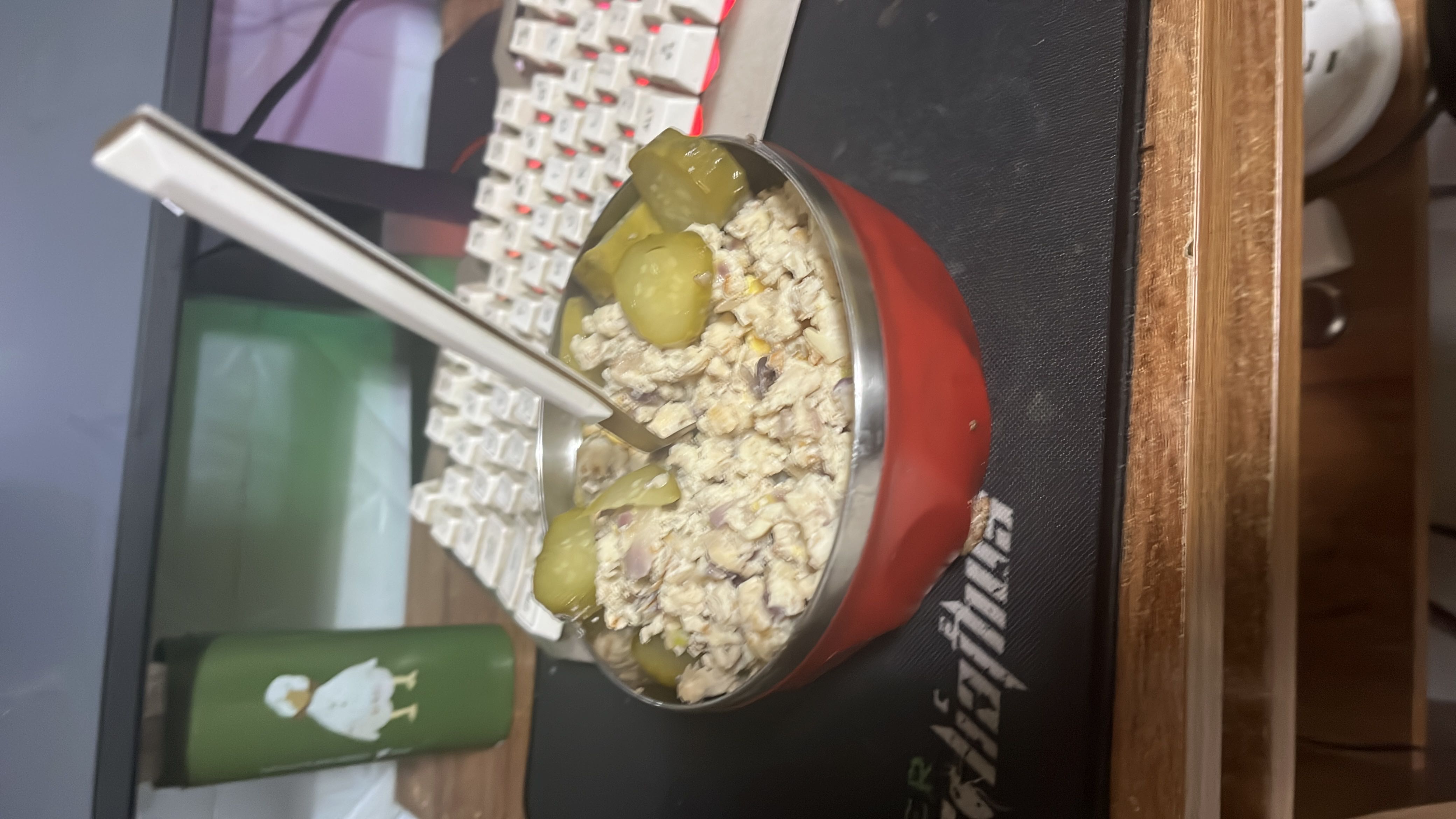 A bowl of mixed oats, ground meat, onions, and pickles, providing a balanced mix of protein, carbs, and fats.