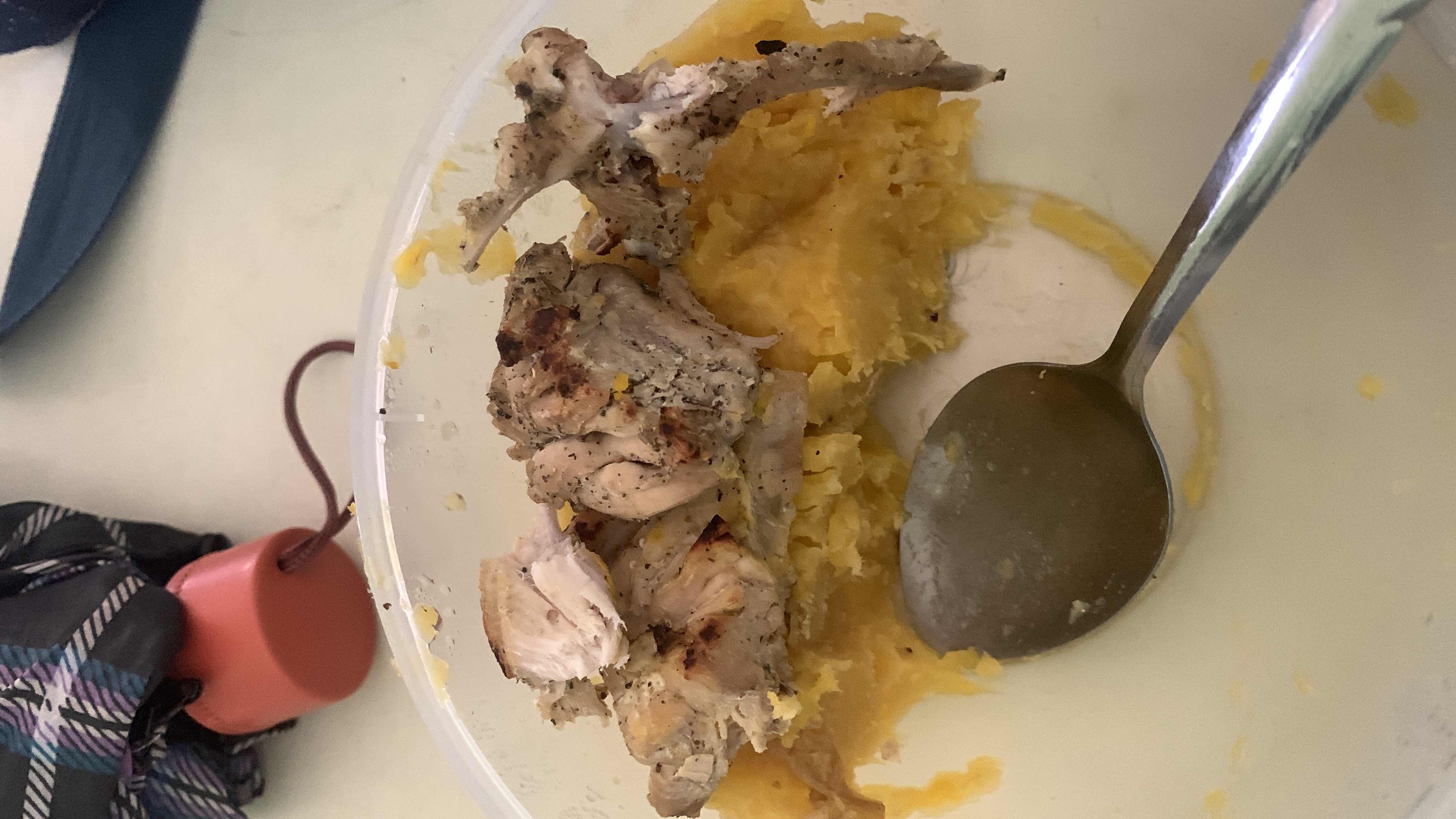 A meal consisting of grilled chicken served over mashed sweet potato, providing a balanced mix of protein, carbs, and fats.