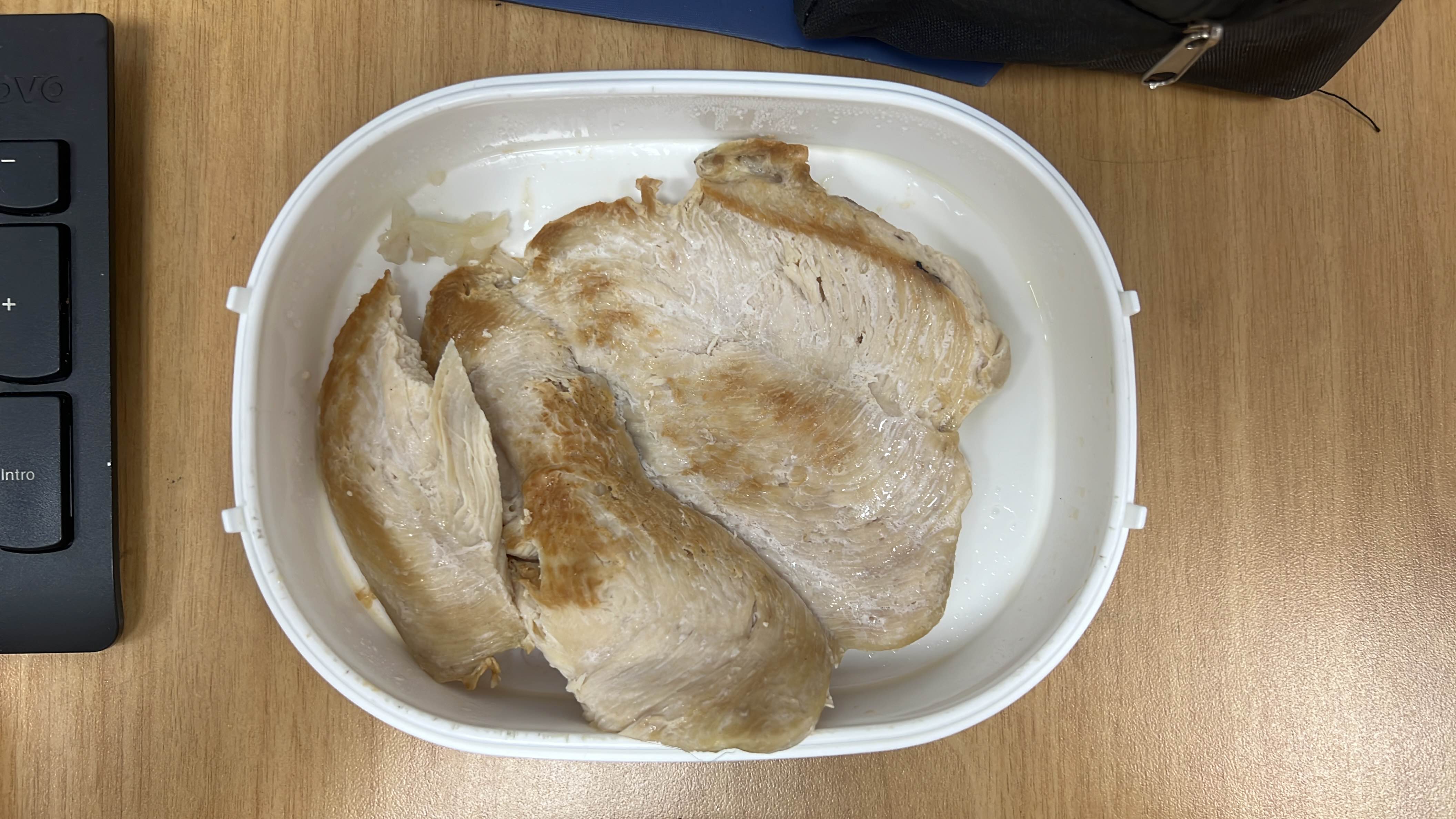 The image shows cooked chicken breast, a high-protein, low-fat food item.