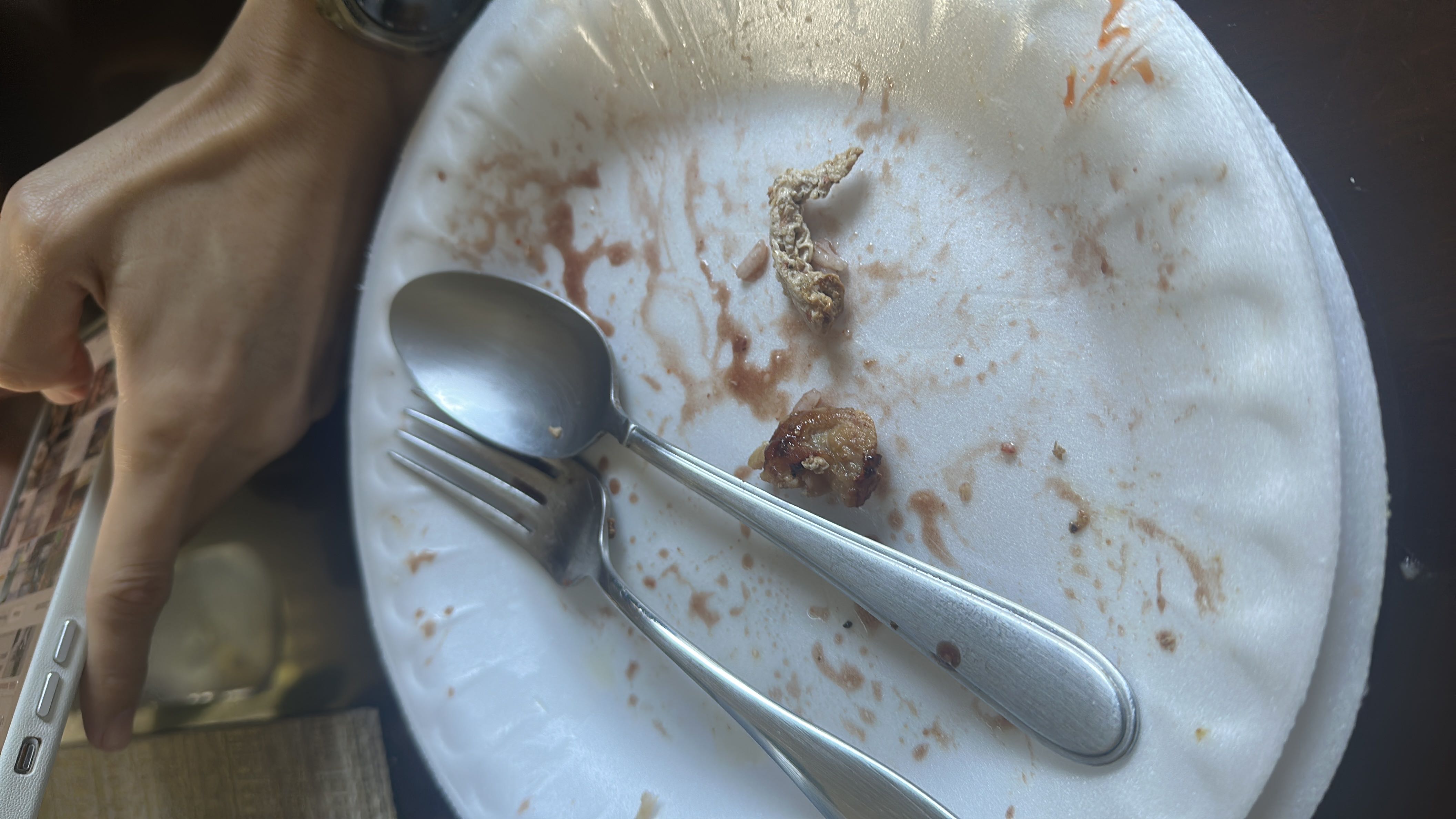 The image shows an empty plate with minimal food remnants, making it impossible to determine specific nutritional information.