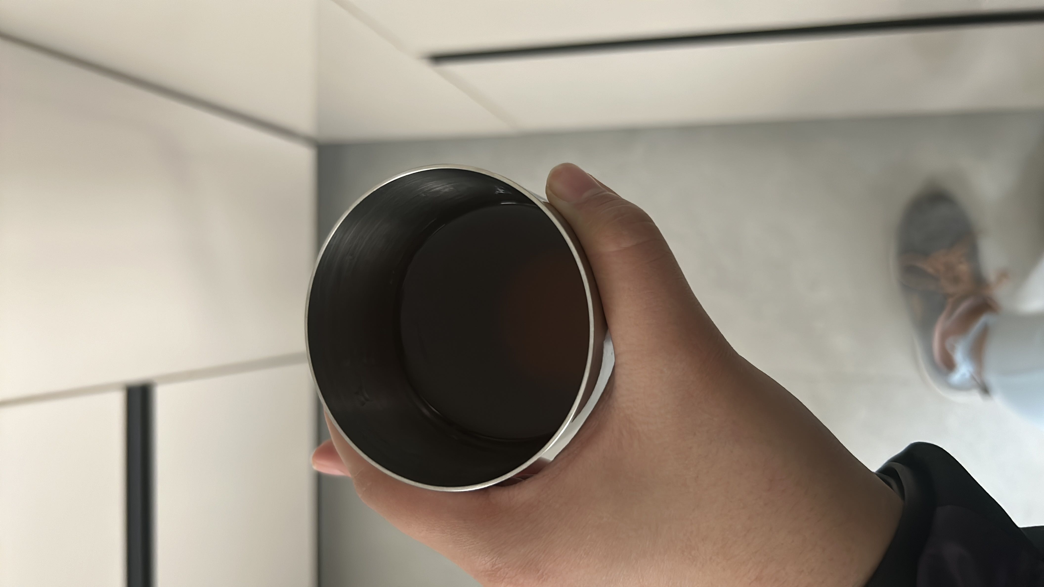 A cup of black coffee, low in calories and free of fats and proteins.