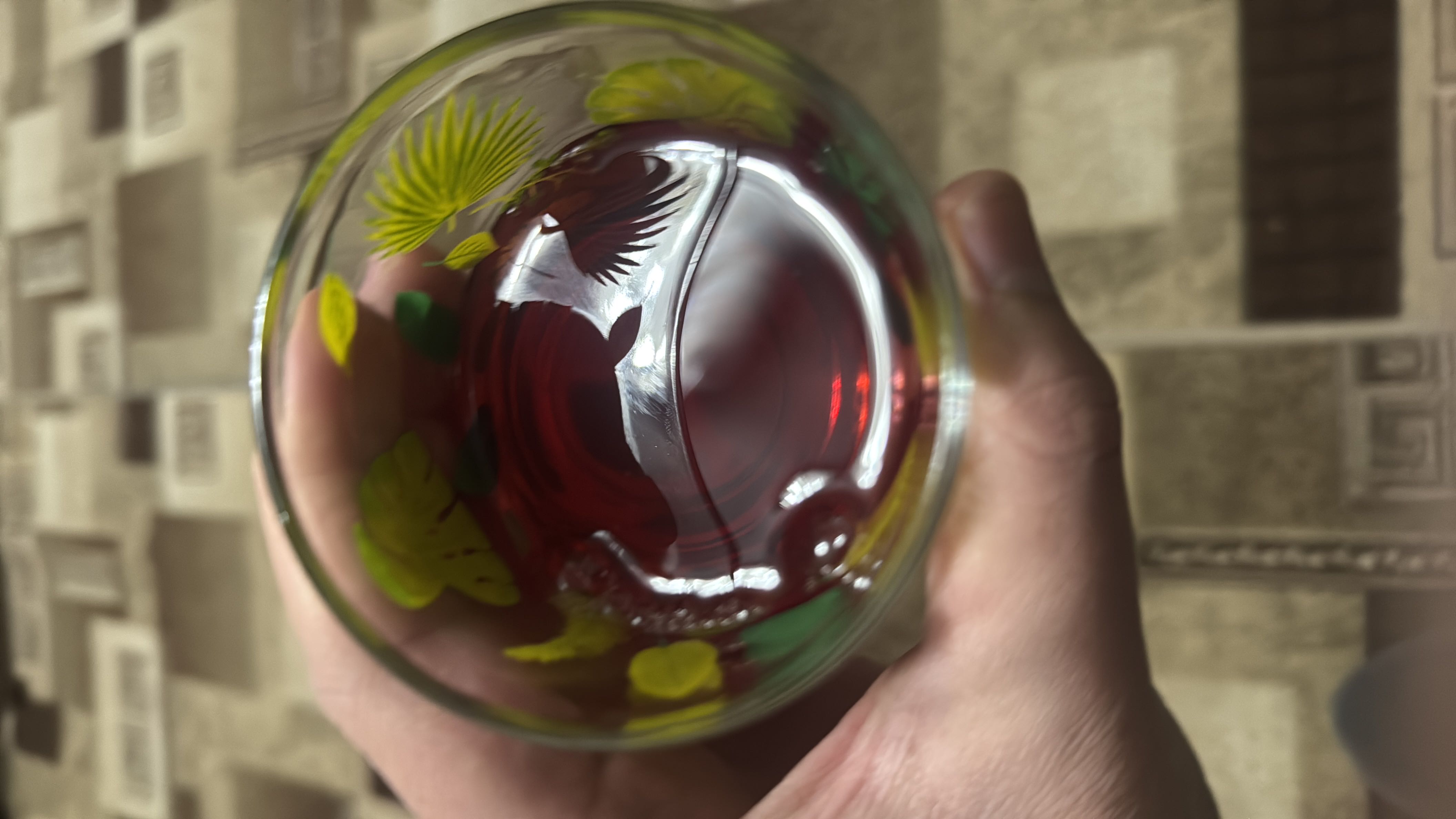 A glass of red juice, likely a fruit-based beverage, with moderate calorie content and no fats or protein.