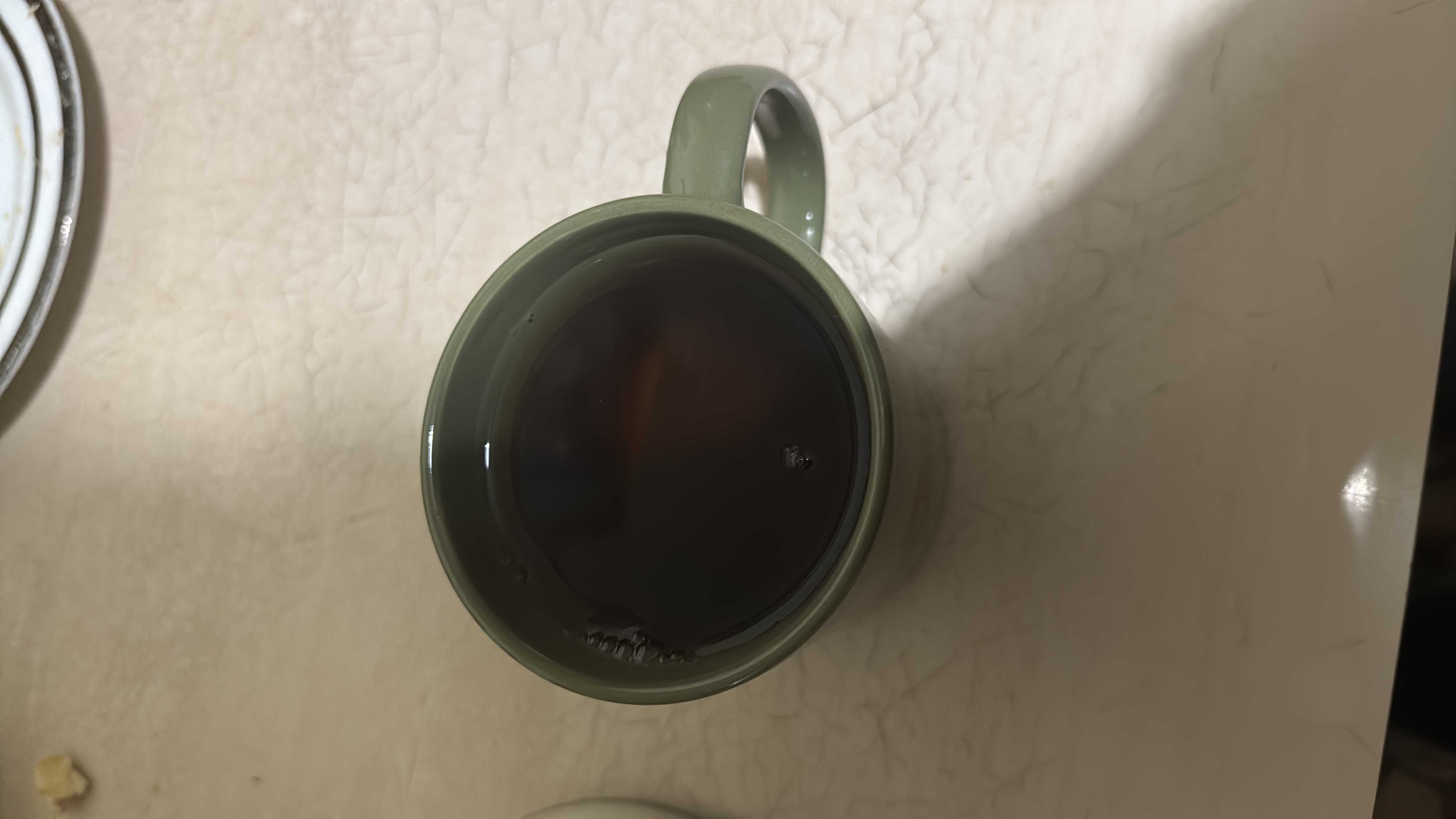 A cup of black tea with minimal calories and no significant macronutrients, making it a healthy beverage choice.