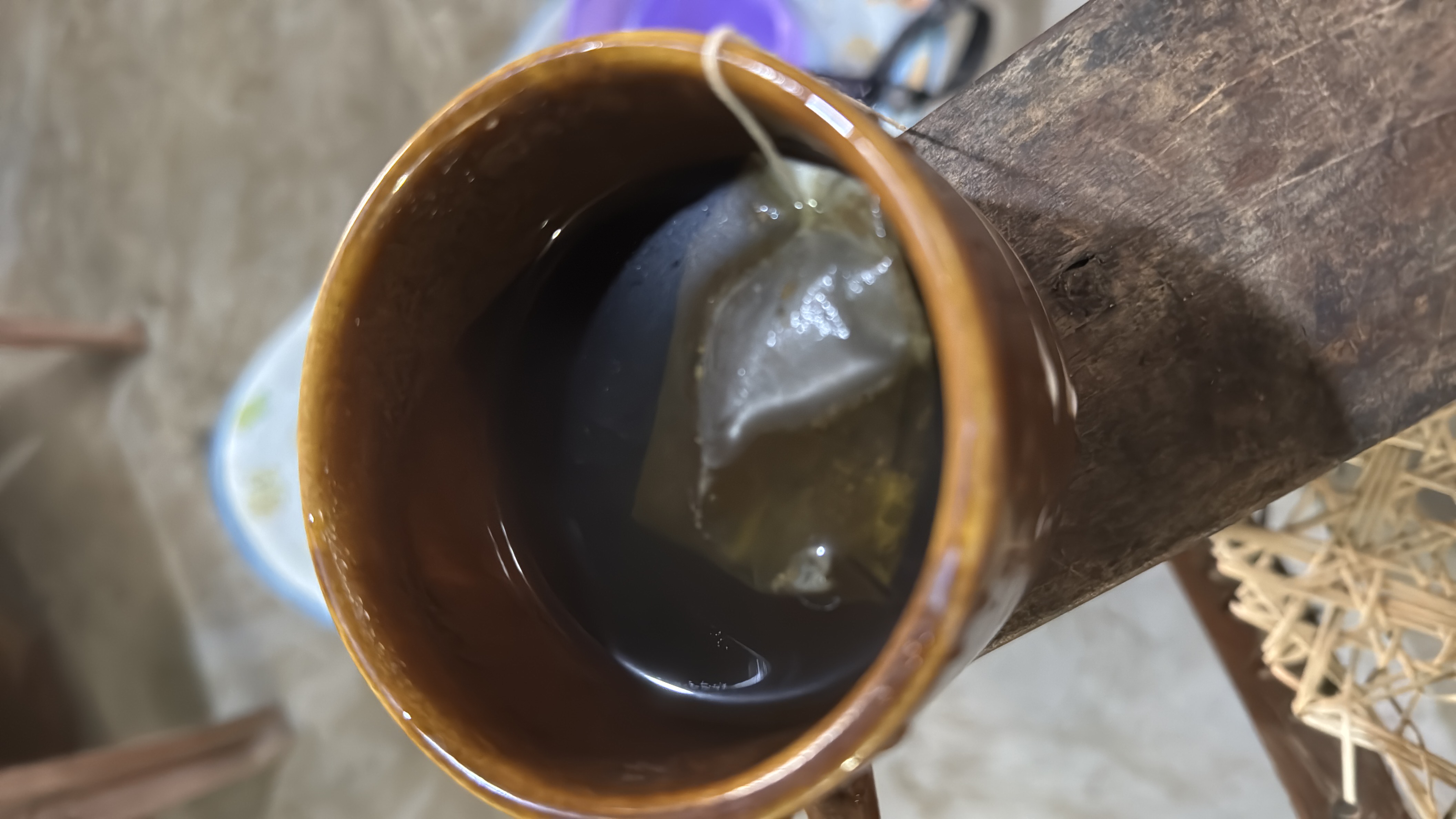 A cup of tea made with a tea bag, containing minimal calories and no significant macronutrients.