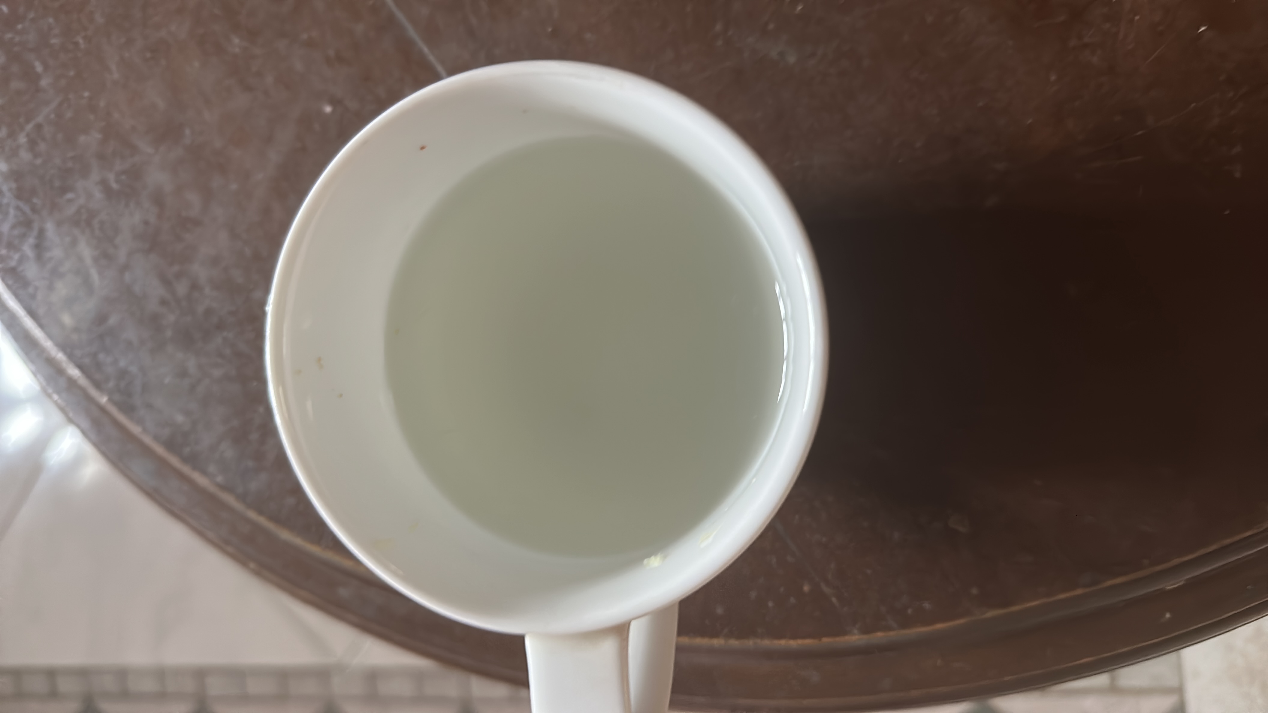 A cup of plain water, which is calorie-free and contains no macronutrients.