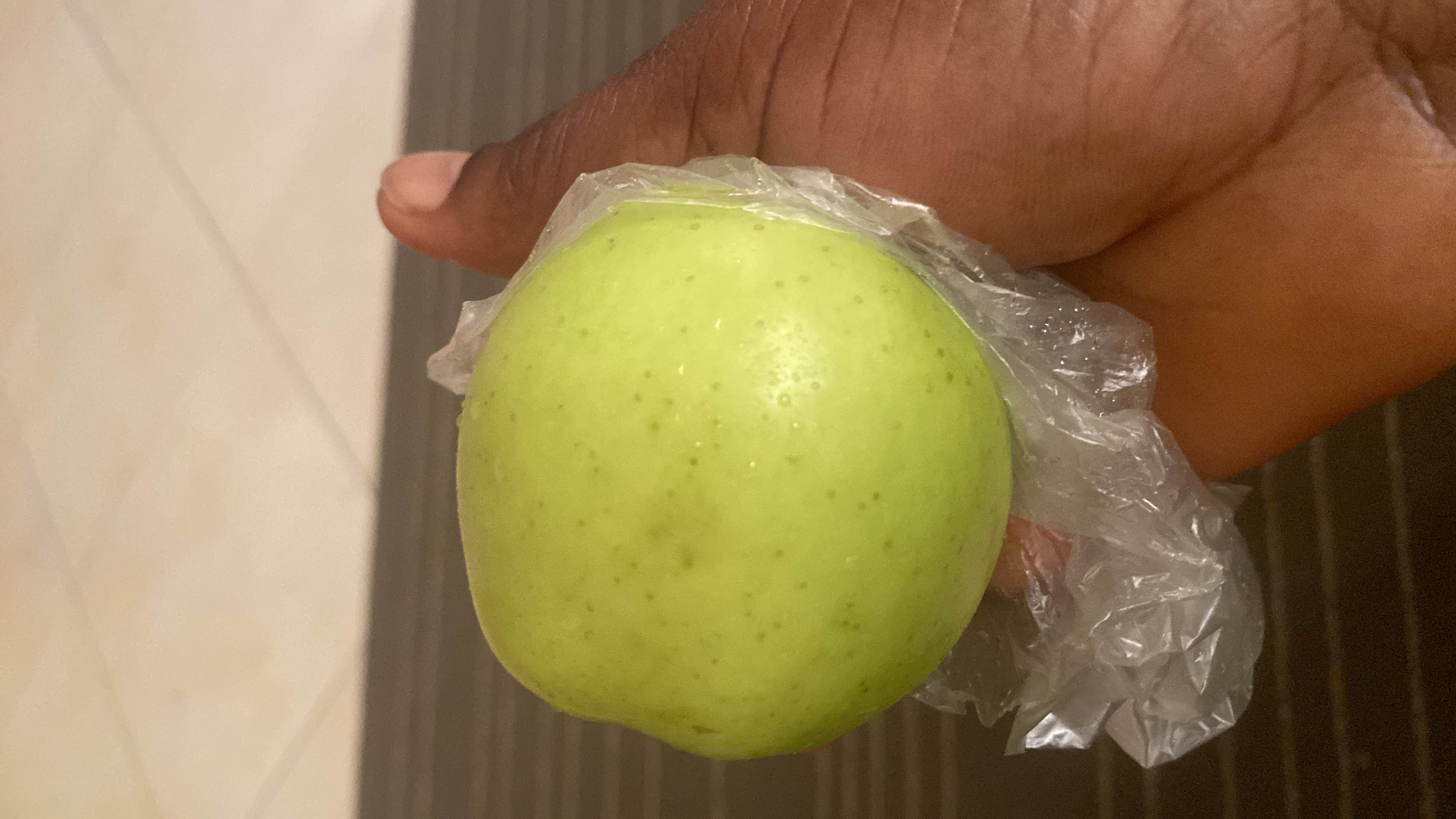 The image shows a green apple, which is a nutritious fruit low in calories and fats, and high in carbohydrates.