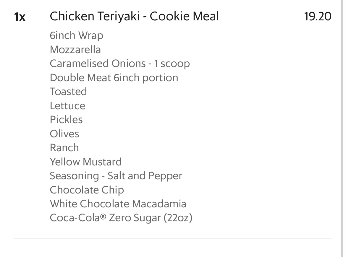 A Chicken Teriyaki Cookie Meal consisting of a 6-inch wrap with mozzarella, caramelized onions, double meat, and various toppings, served with cookies and a Coca-Cola Zero Sugar drink.