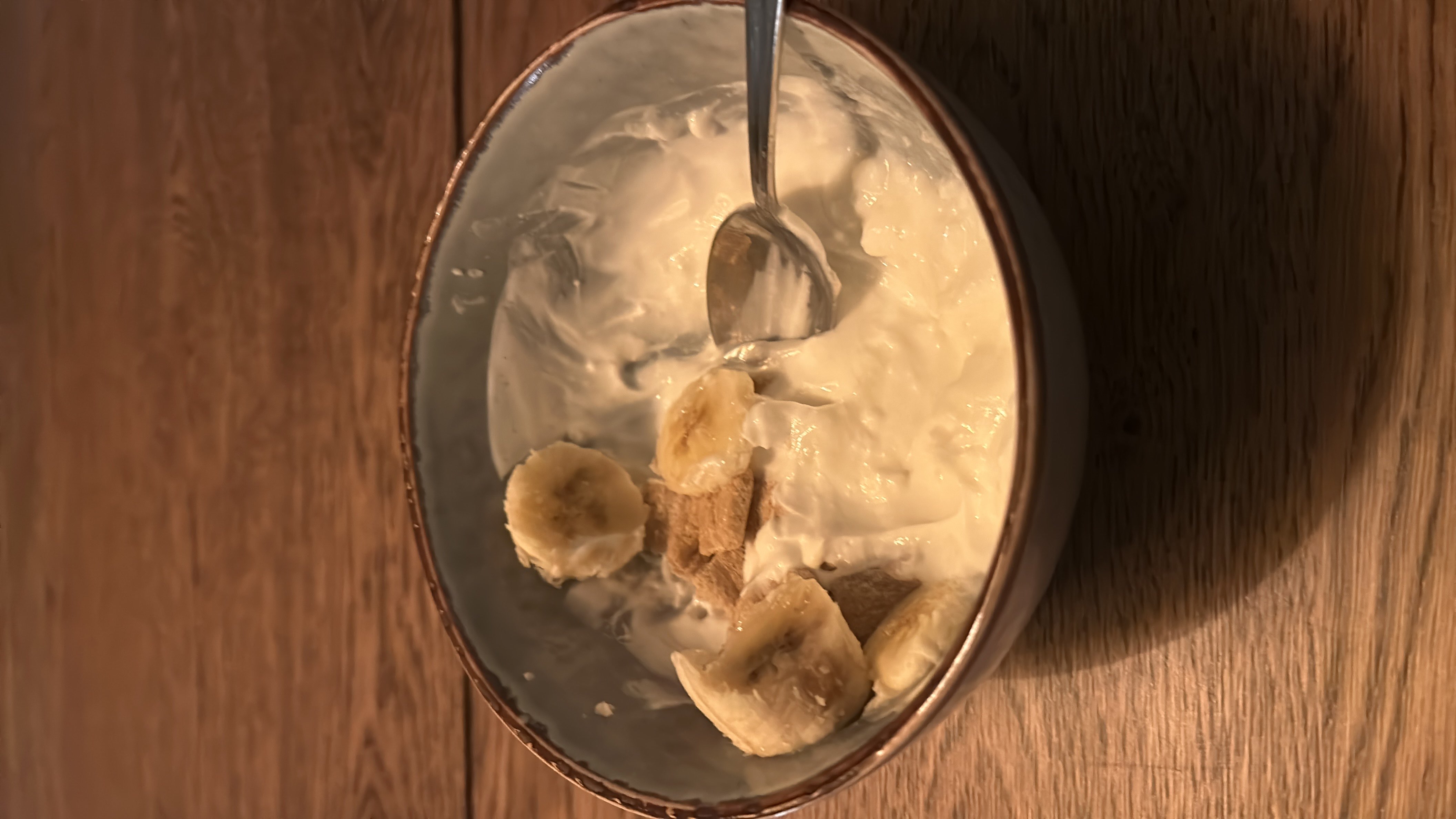 A protein-packed meal with Greek yoghurt, cottage cheese, banana, high protein oatpuffs, and a high fiber sandwich featuring turkey, cheese, cucumber, and egg, offering a balanced mix of protein, carbohydrates, and fats.