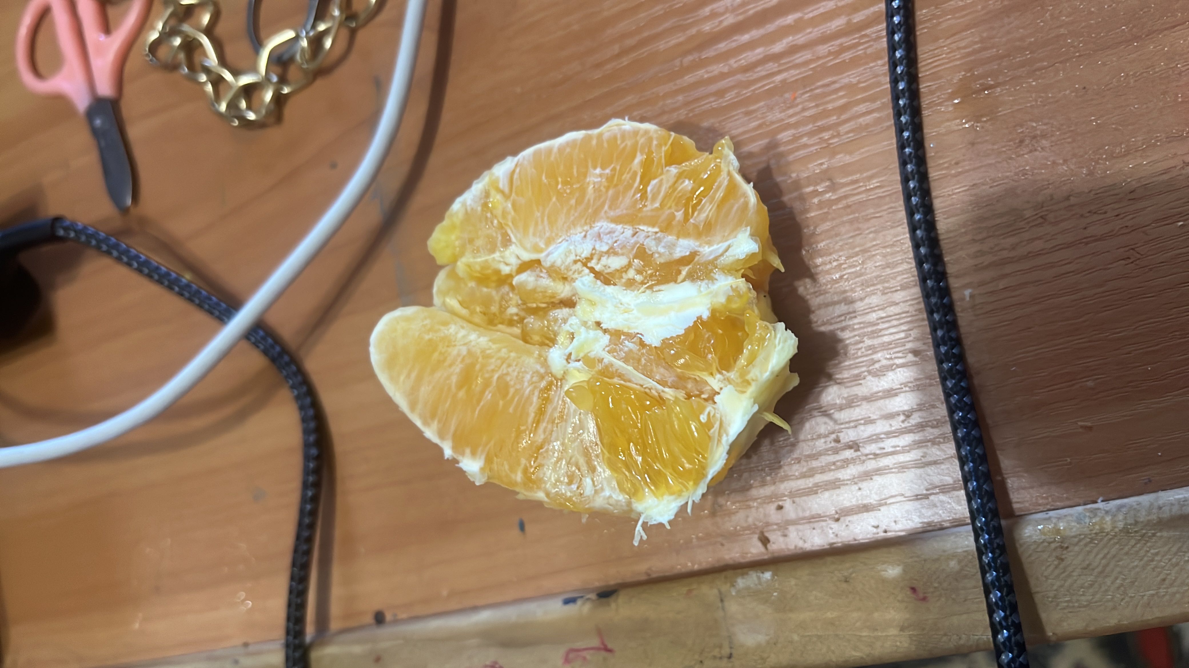 The image shows a peeled orange, which is a low-calorie fruit rich in vitamin C and carbohydrates.