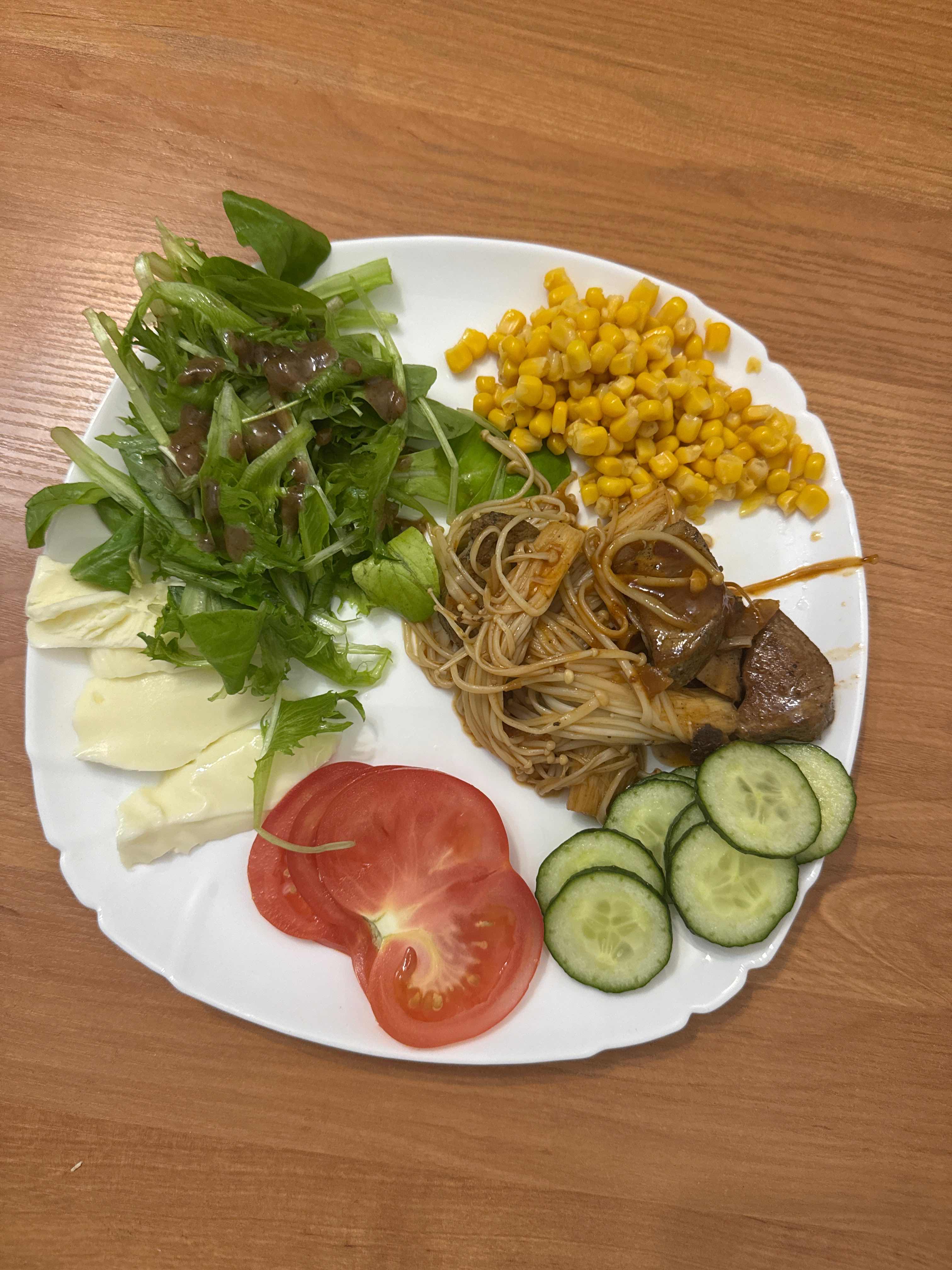 A balanced plate with vegetables, noodles, and cheese, providing a mix of protein, carbs, and fats.