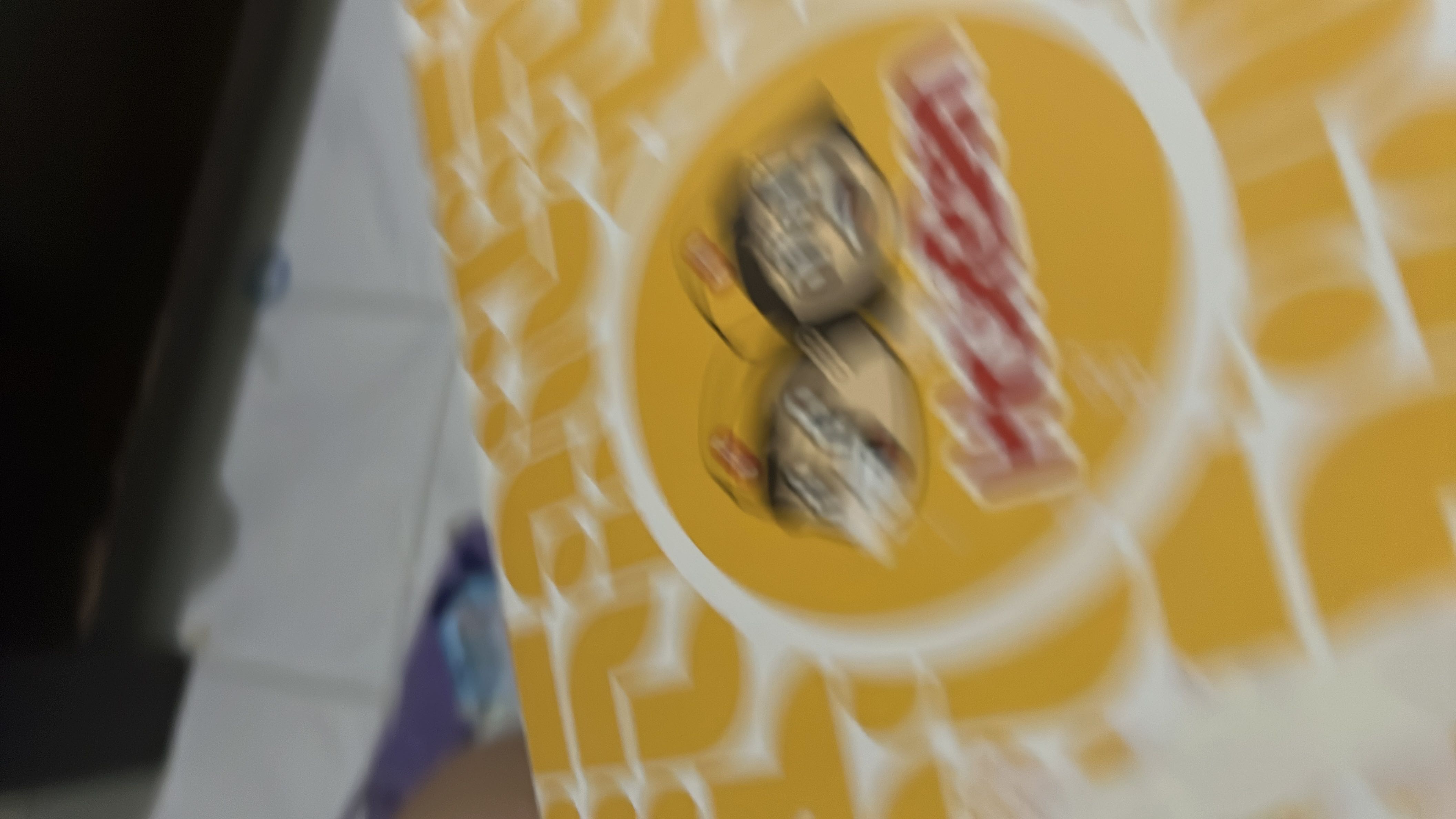 The image is blurry and does not provide clear nutritional information.