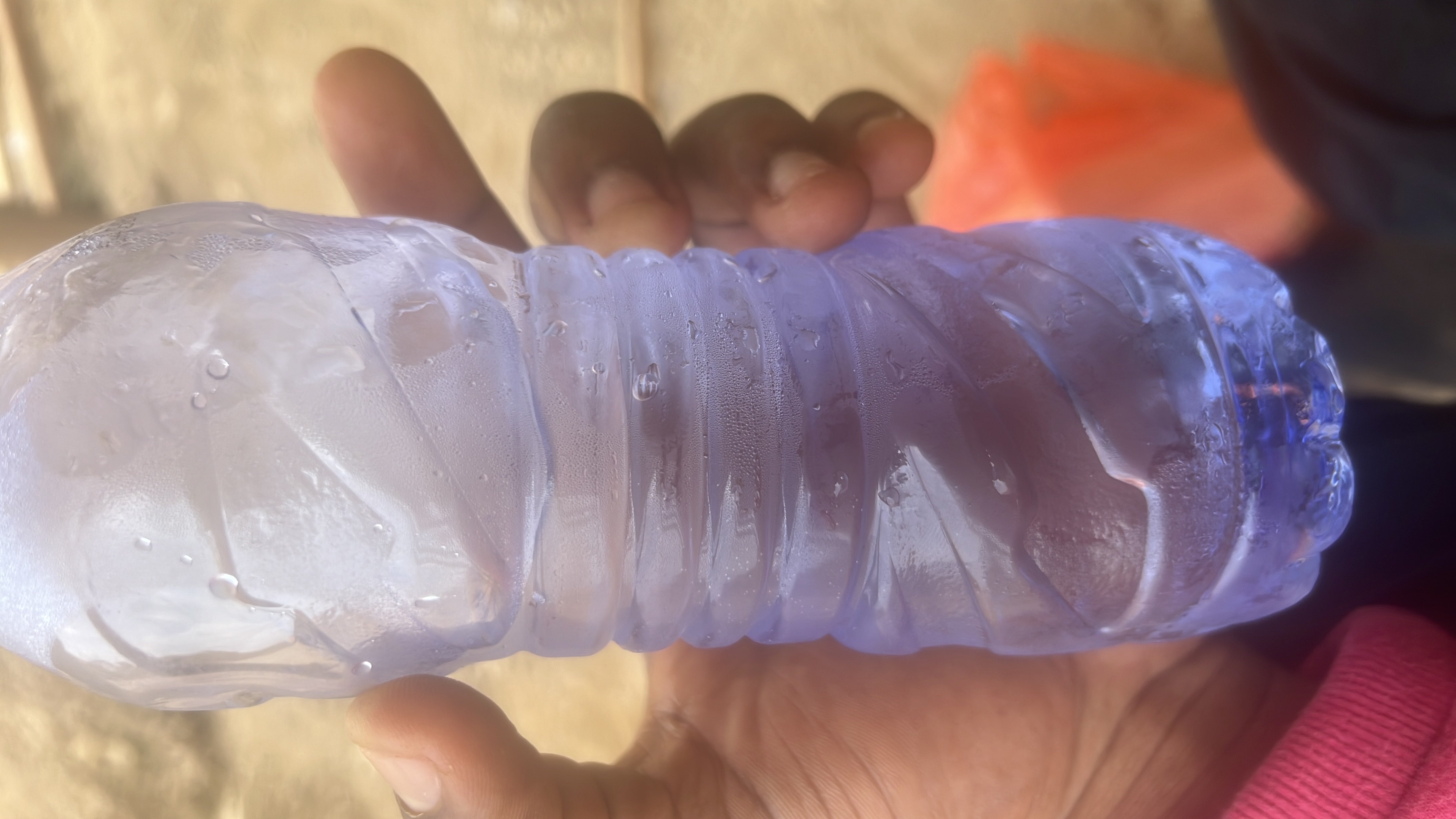 The image shows a bottle of water, which contains no calories, protein, carbs, or fats, making it a highly healthy and hydrating option.