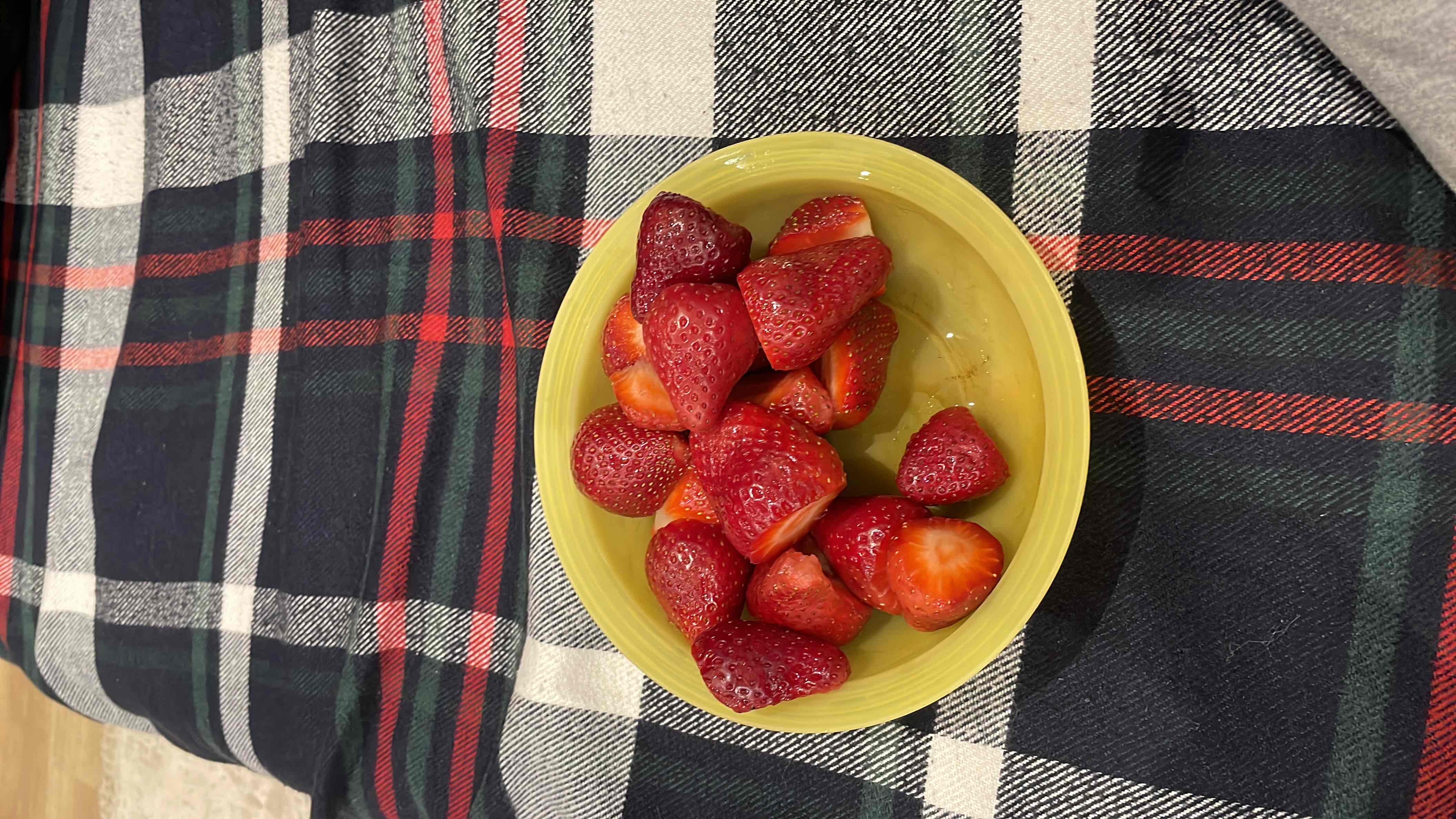 A bowl of fresh strawberries, a low-calorie and nutrient-rich fruit.