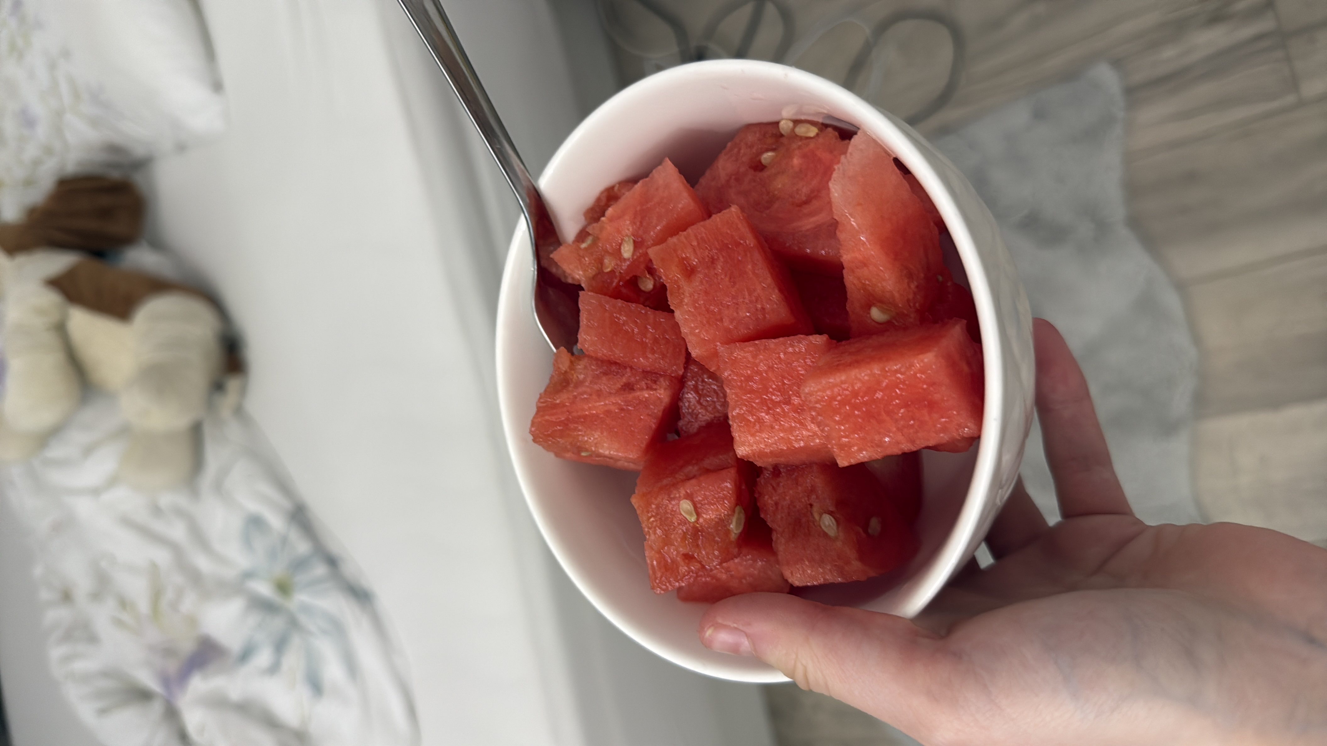 A bowl of fresh watermelon cubes, a low-calorie and hydrating fruit rich in vitamins and antioxidants.