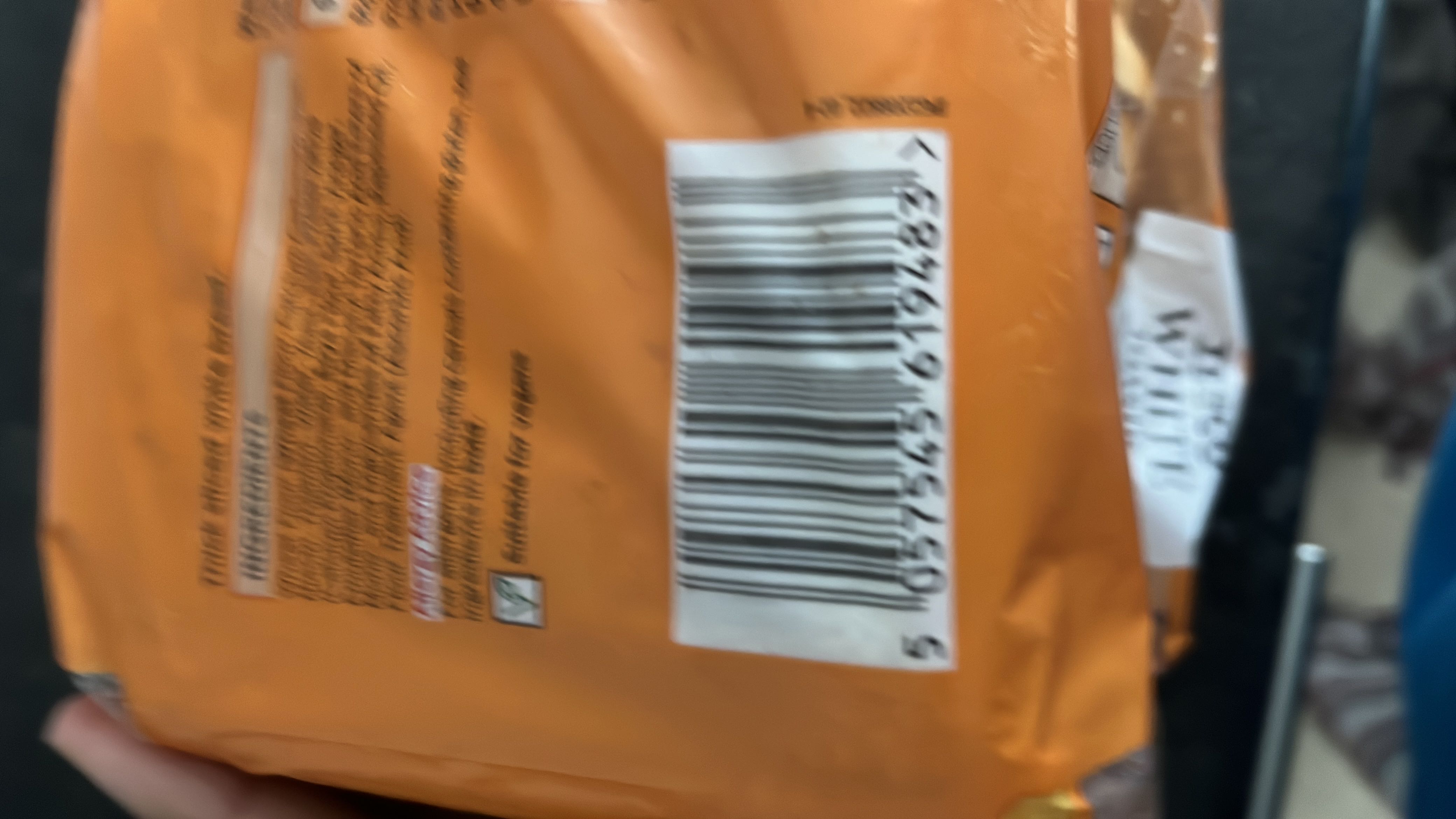 The image is blurry and the nutritional information cannot be extracted.