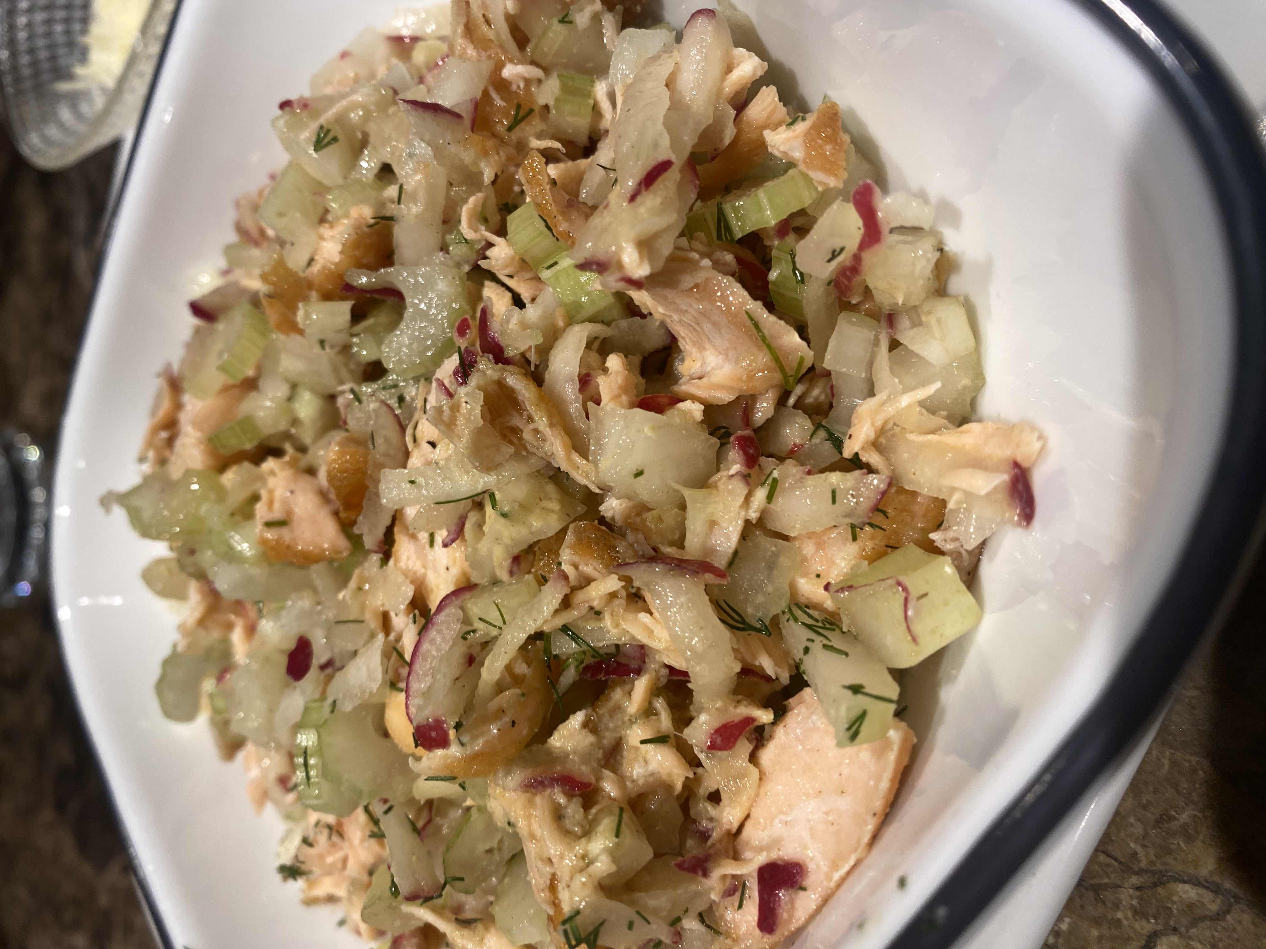 A healthy chicken salad with celery, red onion, dill, and croutons, offering a balanced mix of protein, fats, and carbs.