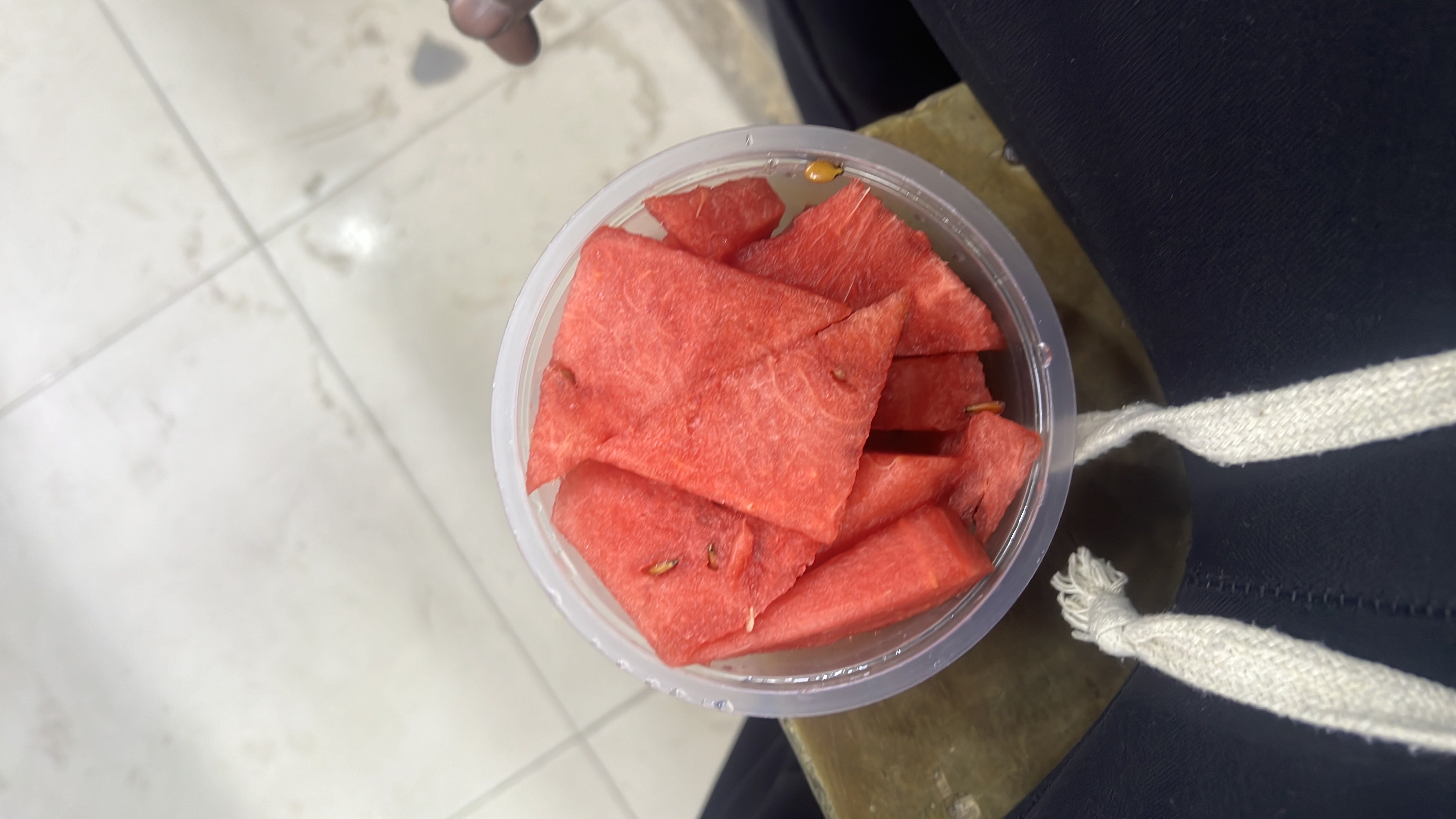 A bowl of fresh watermelon slices, a low-calorie fruit rich in hydration and nutrients.