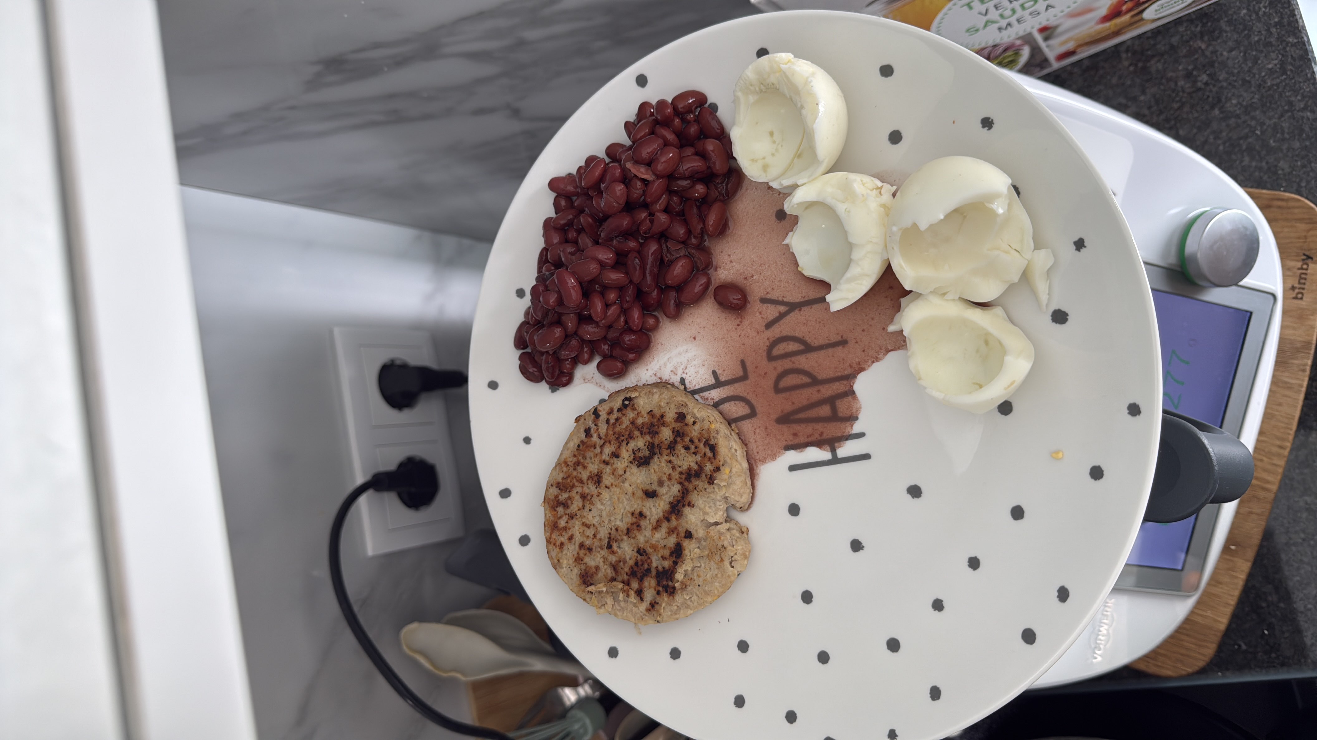 A balanced meal consisting of a grilled patty, red beans, and boiled egg whites, providing a good mix of protein, carbs, and fats.