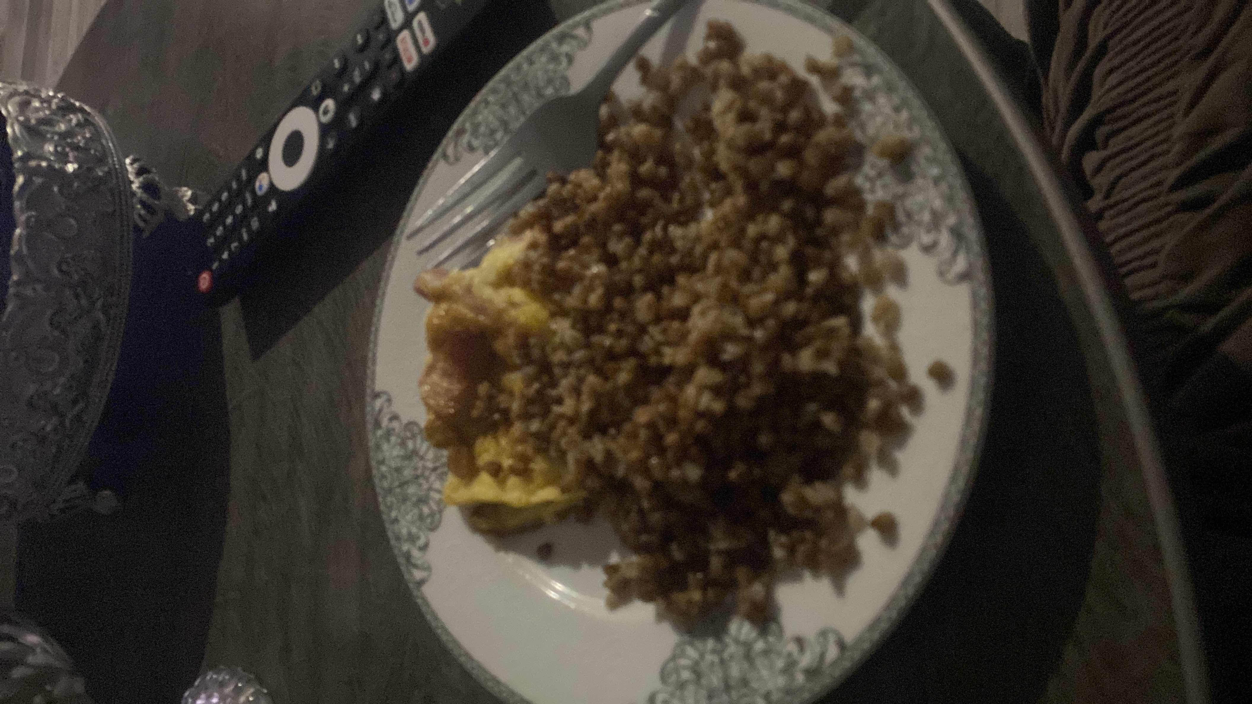 A plate containing cooked buckwheat and an omelette, providing a balanced mix of carbohydrates, protein, and fats.