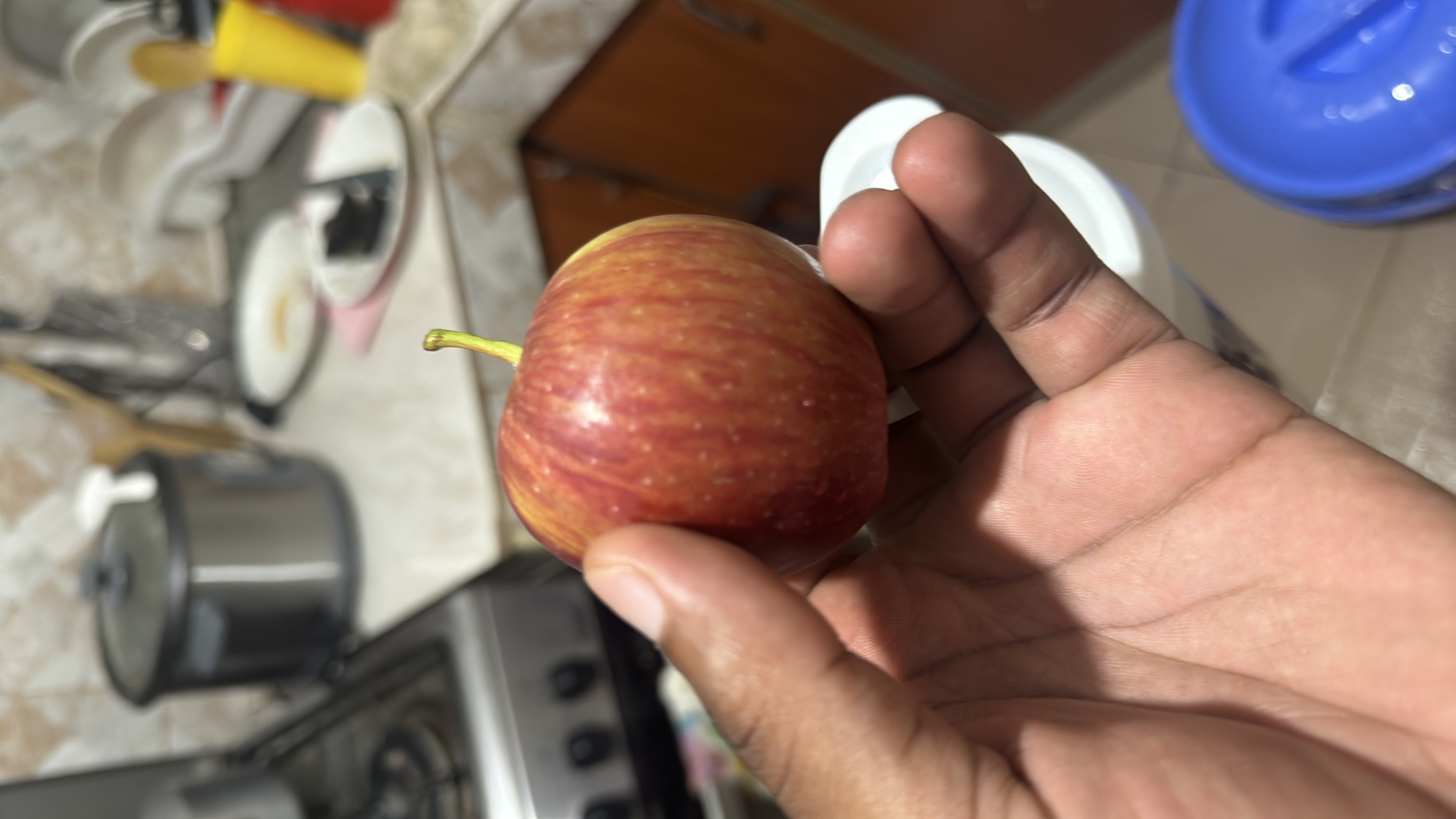 The image shows a fresh apple, which is a nutritious fruit rich in carbohydrates and low in fats and protein.