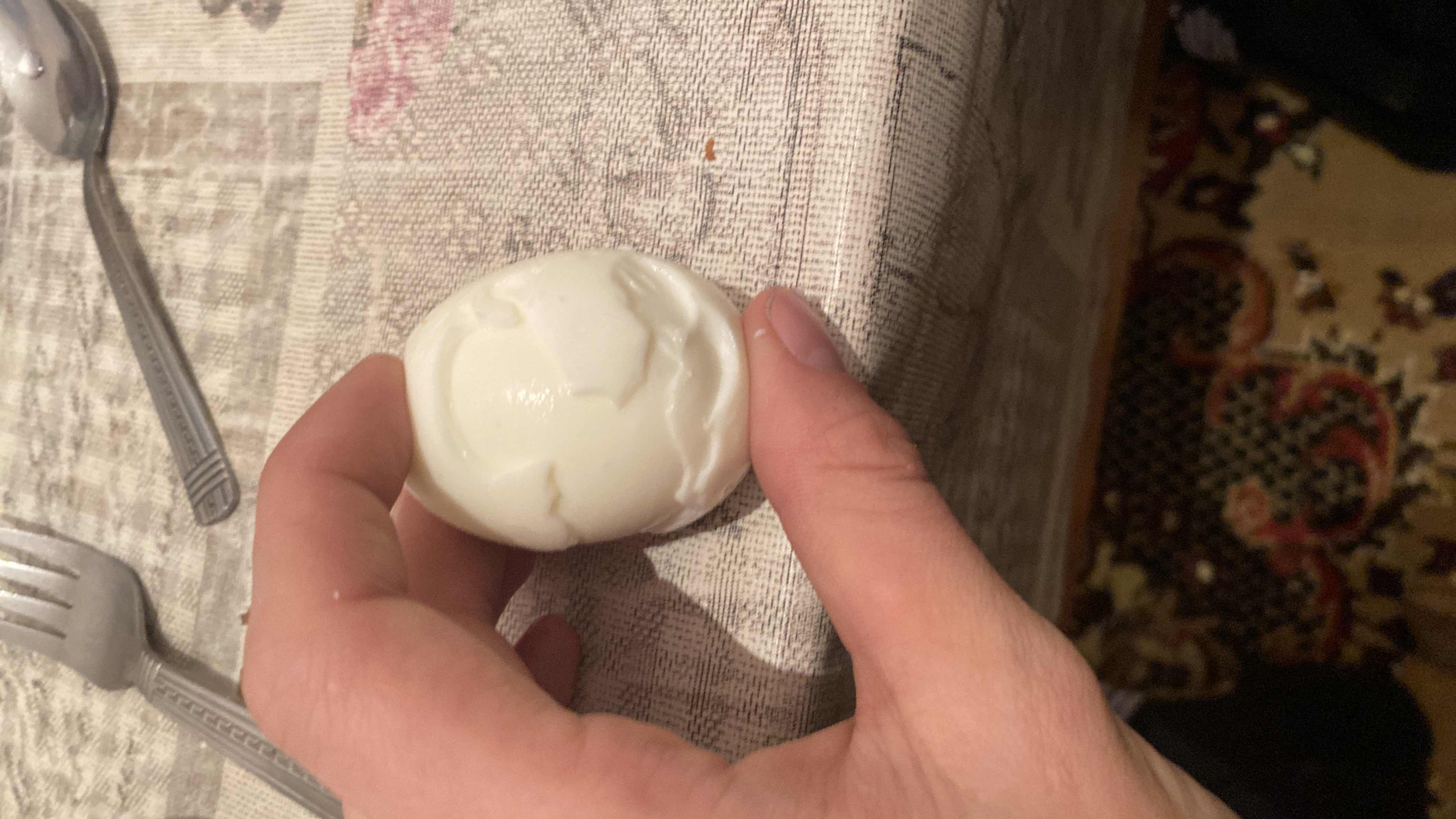 A boiled egg, a nutritious food item high in protein and healthy fats, is shown in the image.