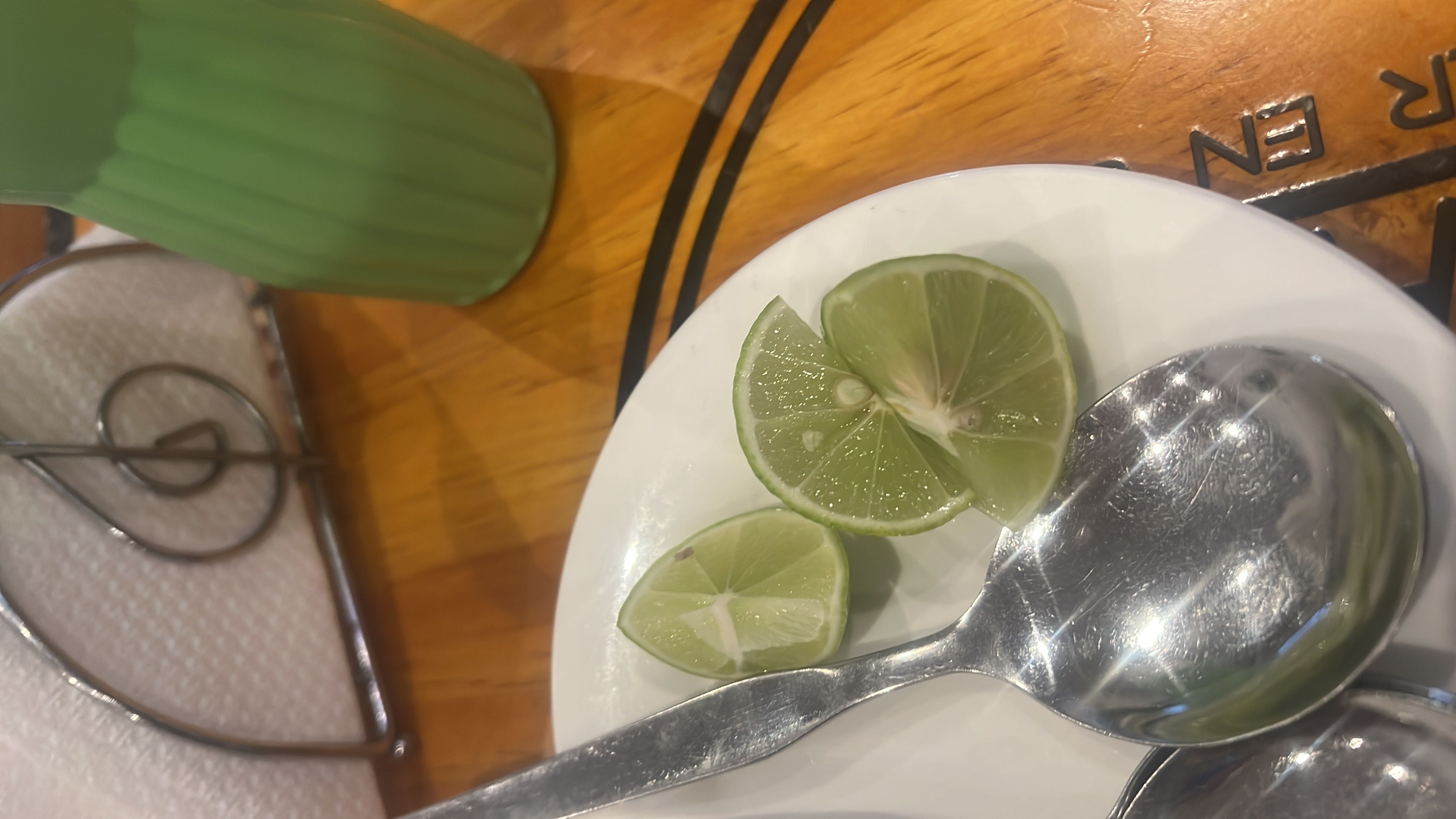 The image shows lime slices, which are low in calories and primarily consist of carbohydrates. They are often used as a garnish or flavor enhancer.