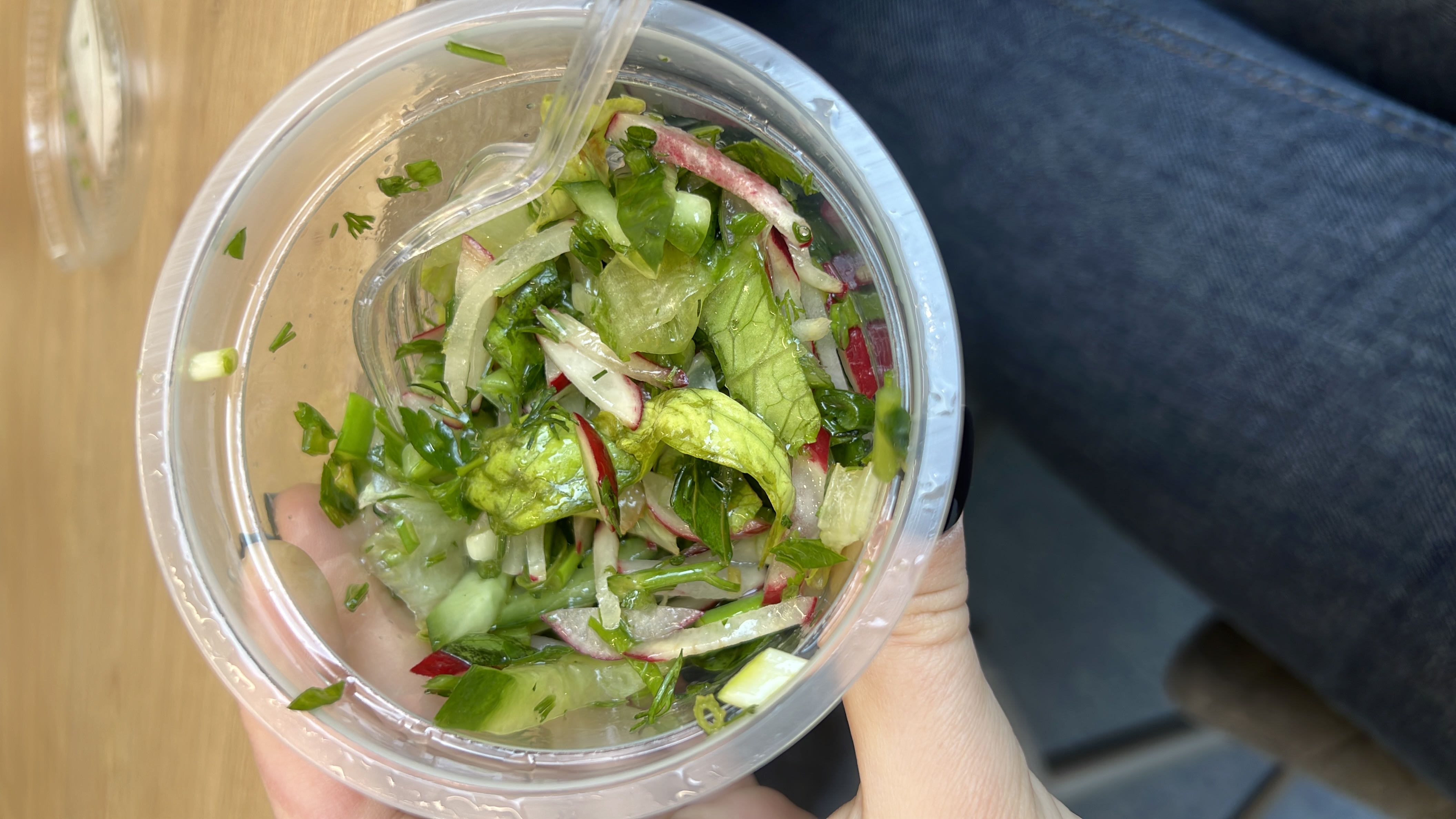 A fresh vegetable salad containing lettuce, radish, cucumber, parsley, and onion, with minimal calories and high nutritional value.