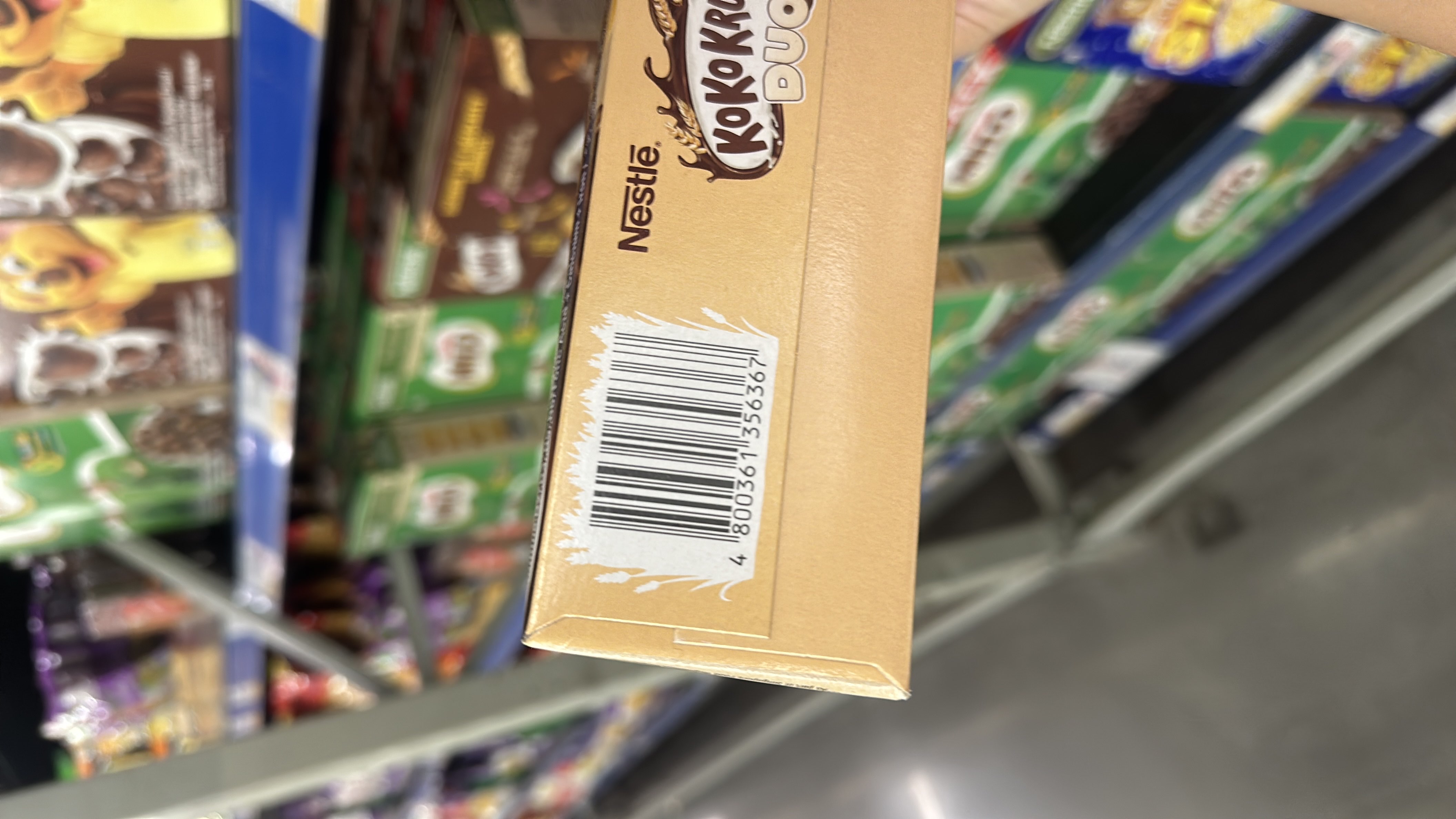 The image shows a Nestle Koko Krunch Duo cereal box, but no nutritional information is visible.