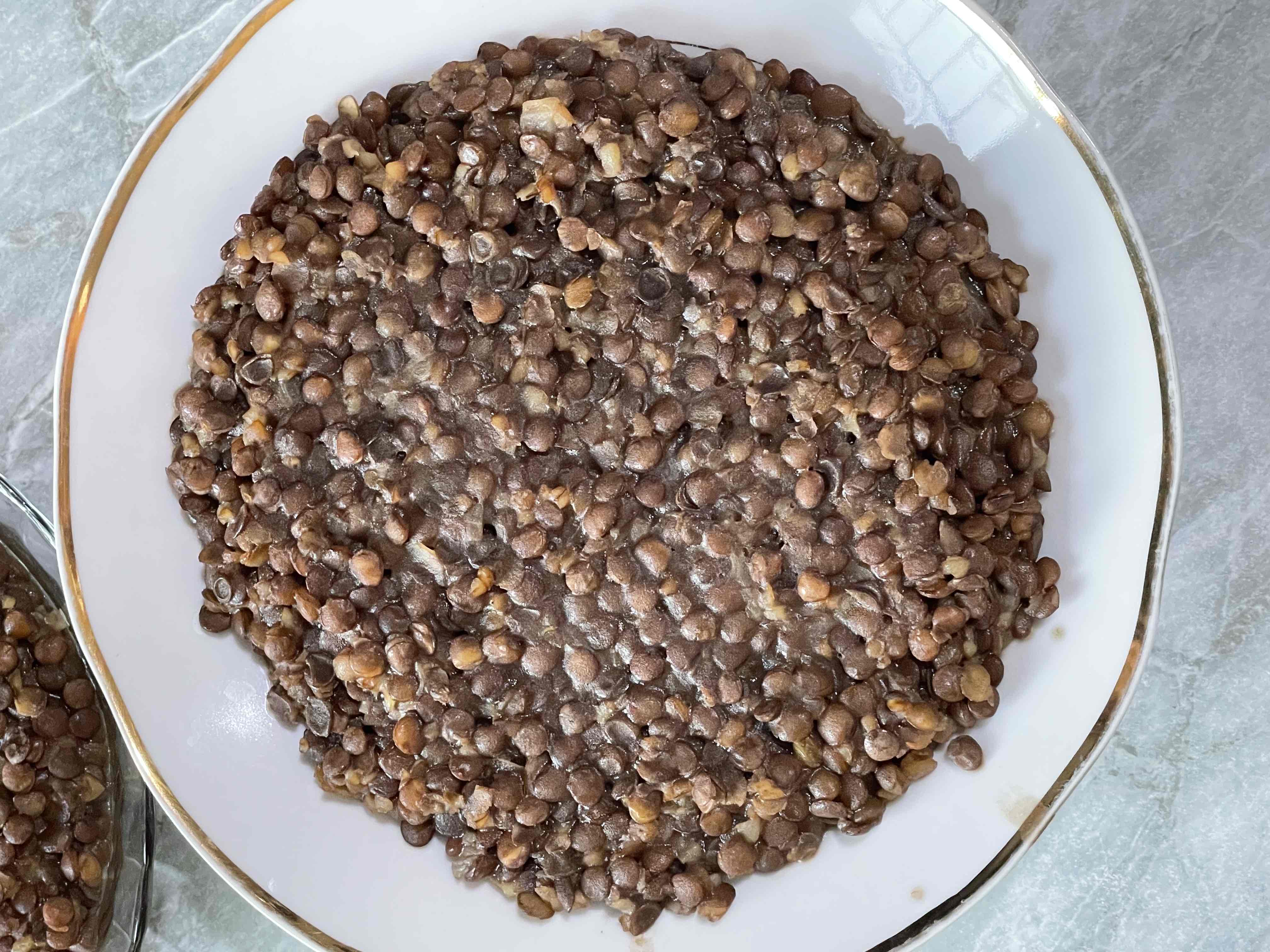 A bowl of cooked lentils, a high-protein, low-fat, and nutrient-dense food.