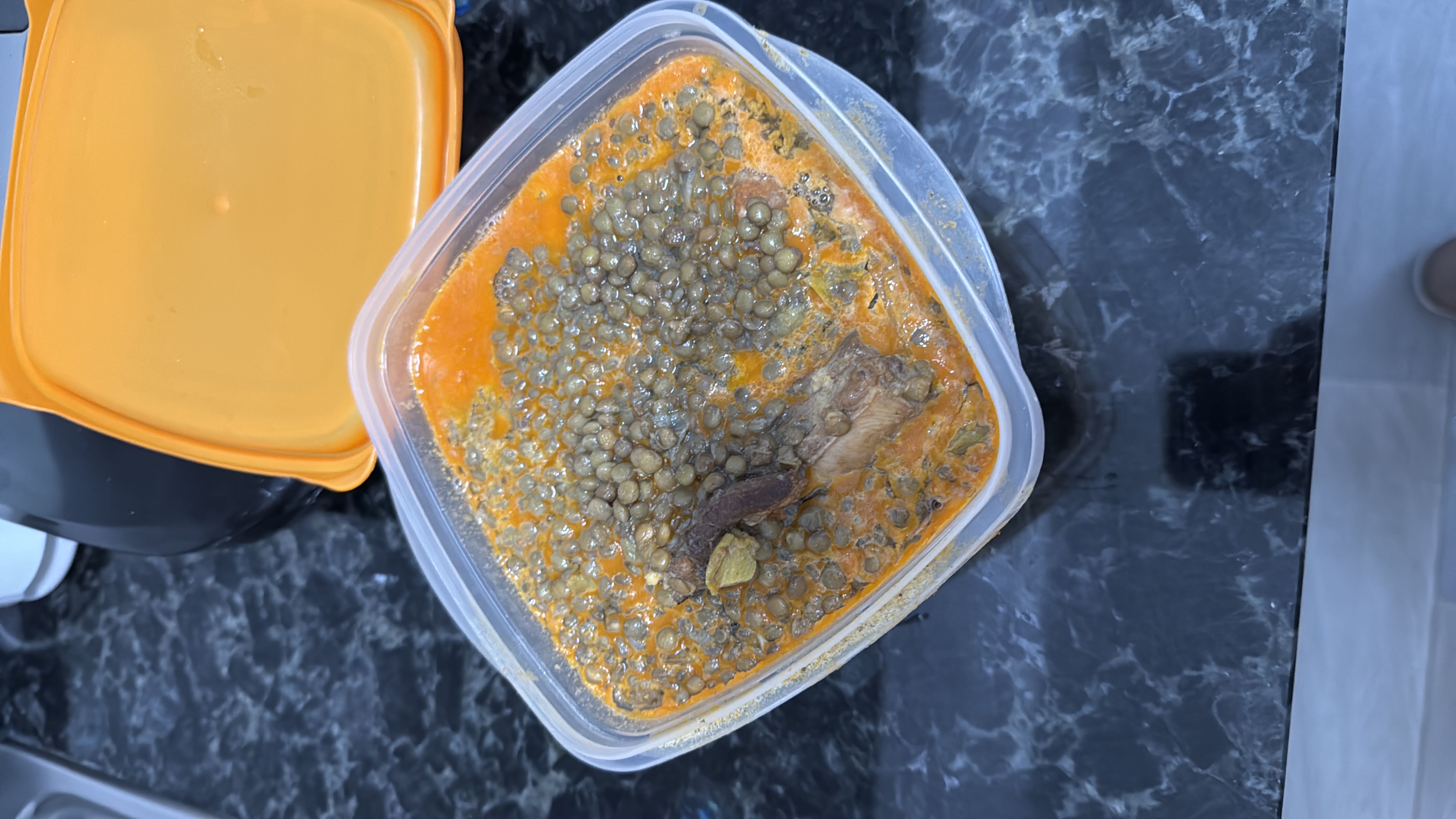 A lentil-based dish cooked in a spiced coconut milk sauce, providing a balanced mix of protein, carbs, and fats.