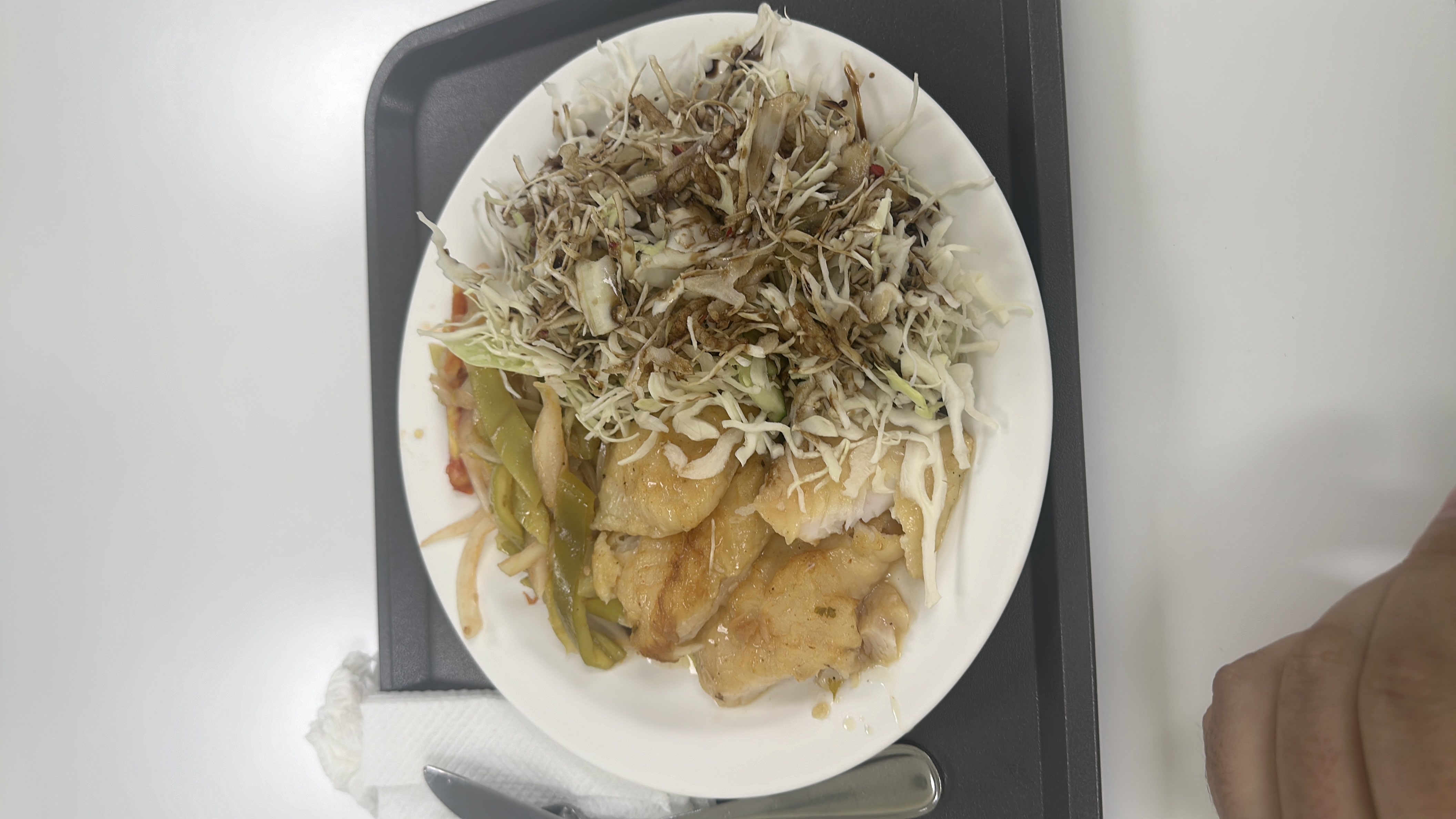 A balanced meal consisting of grilled chicken, cabbage salad, and stir-fried vegetables, providing a good mix of protein, carbs, and fats.