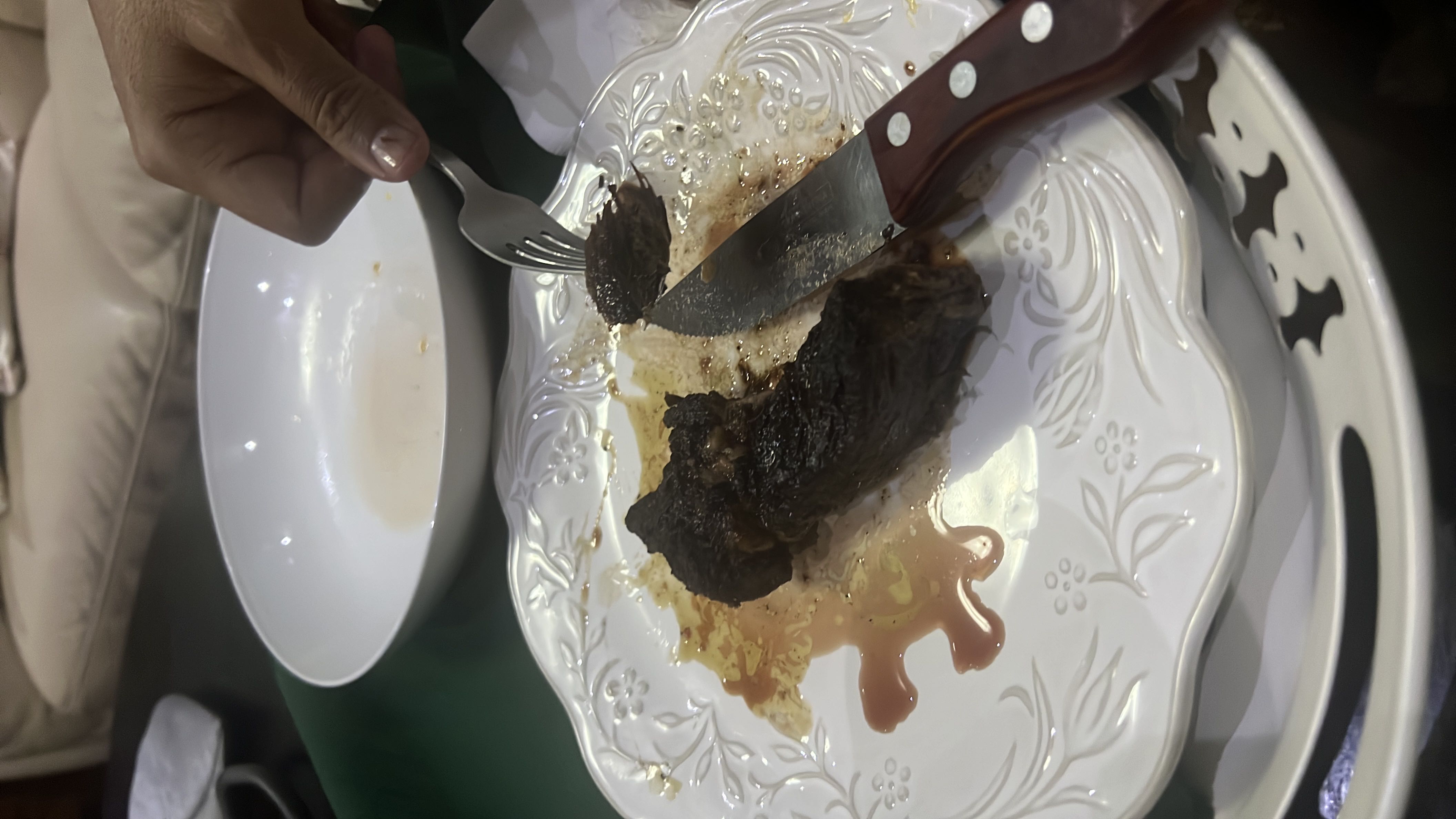 A serving of grilled meat with sauce, providing a high protein content with moderate fats and minimal carbohydrates.