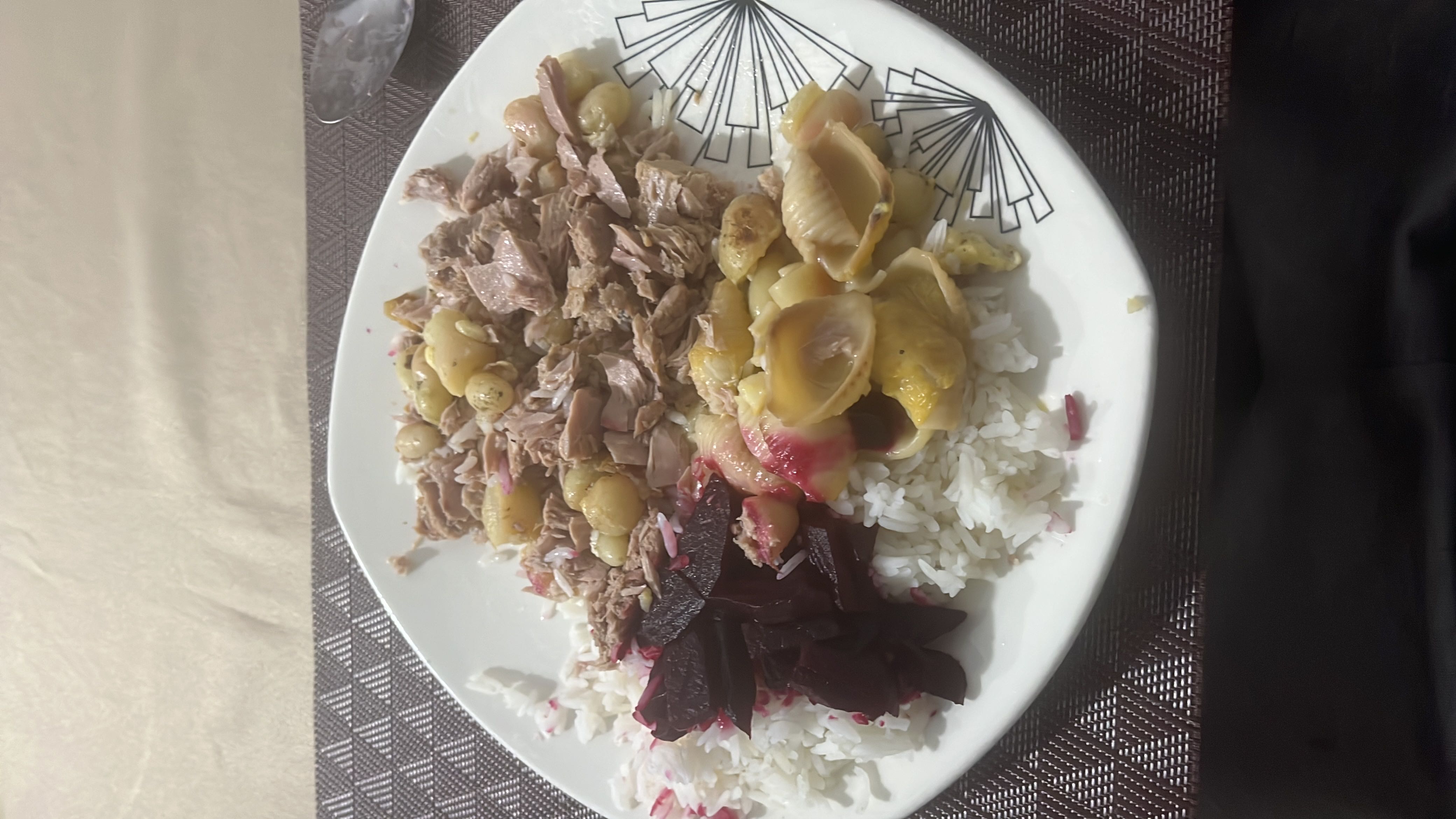 A balanced meal consisting of rice, tuna, beetroot, shellfish, and gingko nuts, providing a good mix of protein, carbohydrates, and healthy fats.