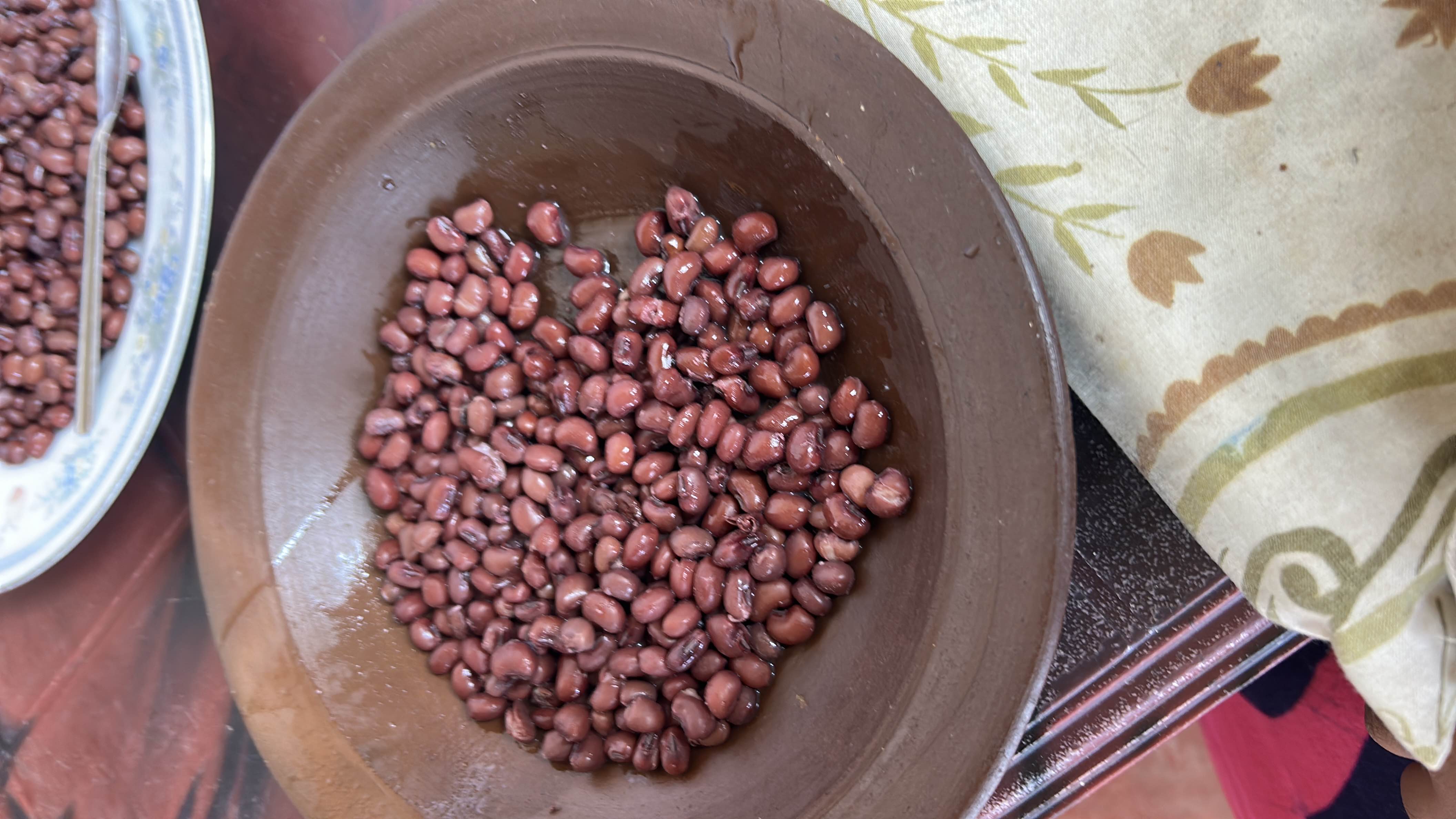 A serving of cooked red beans, rich in protein and carbohydrates, providing a nutritious and healthy meal option.