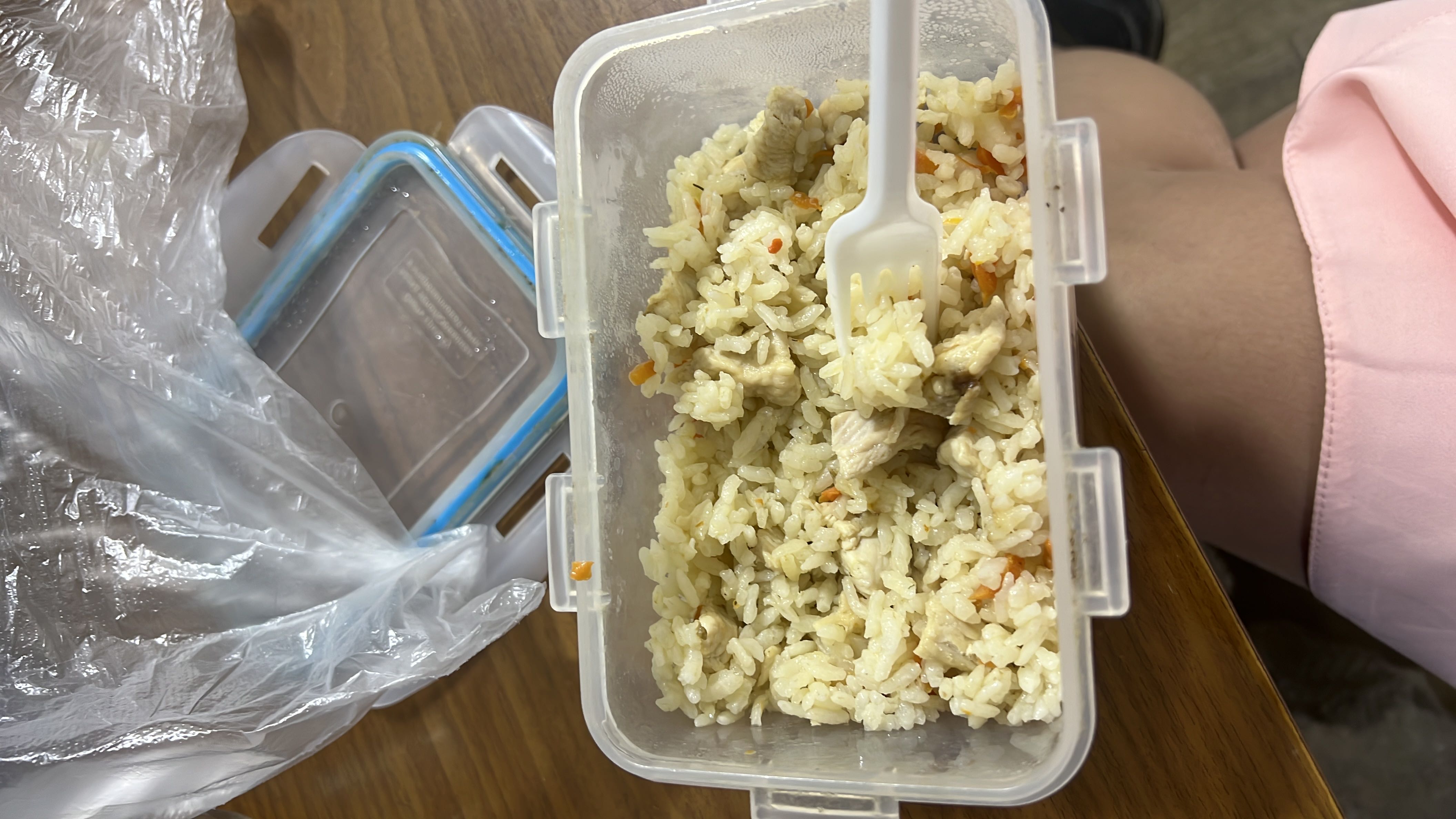 A meal consisting of rice, chicken, and carrots, providing a balanced mix of protein, carbohydrates, and fats.